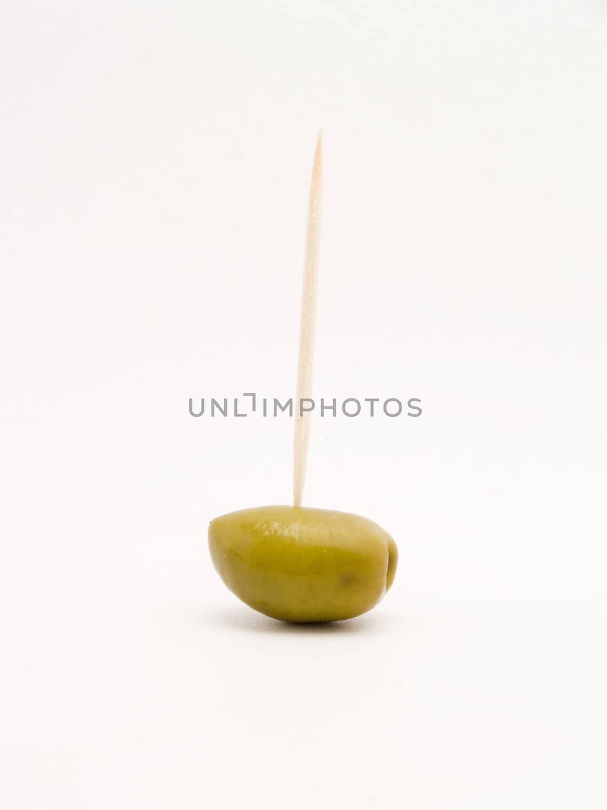 green olives with toothpicks by lauria