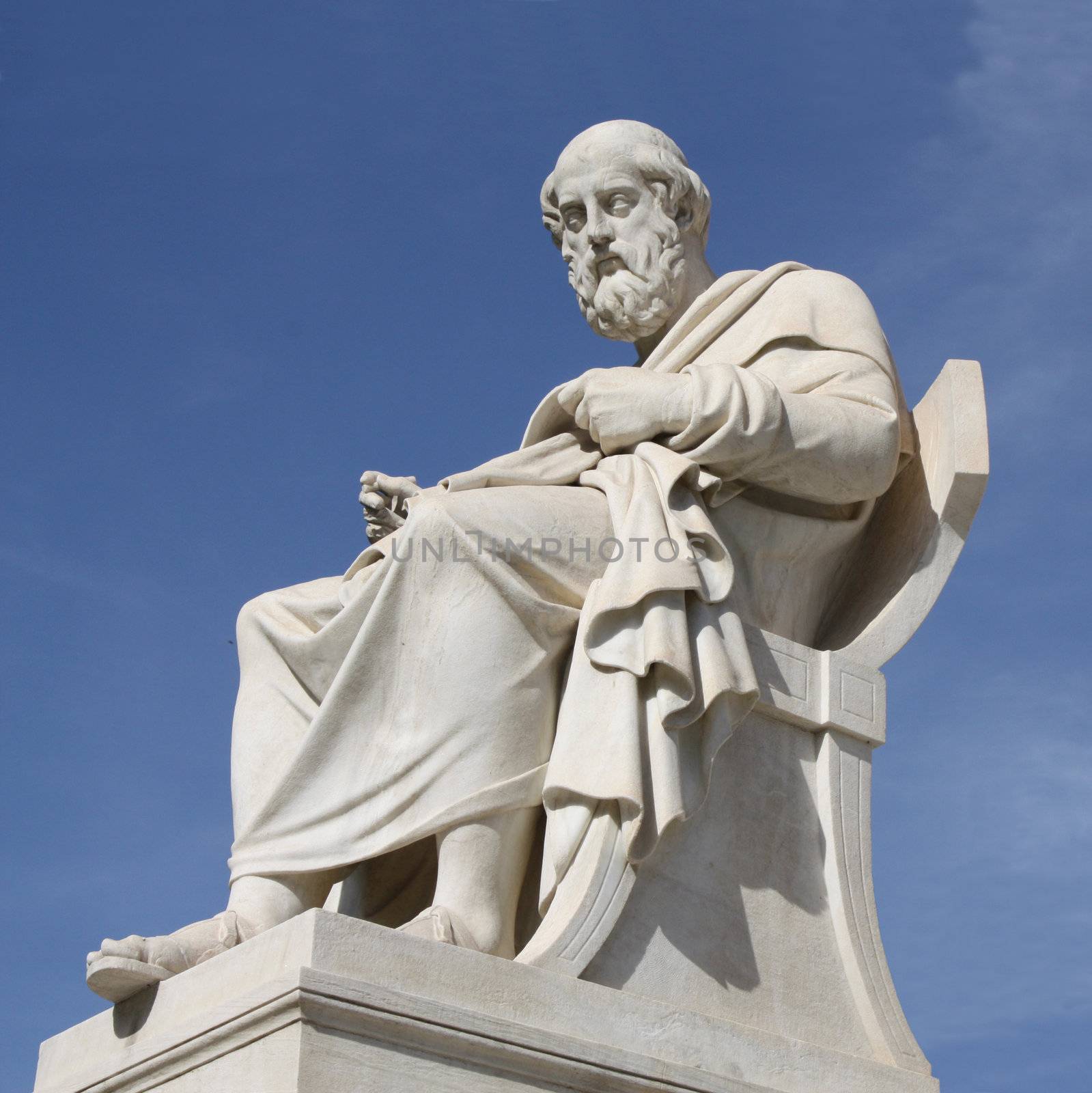 Neoclassical statue of ancient Greek philosopher, Plato, in front of the Academy of Athens in Greece.