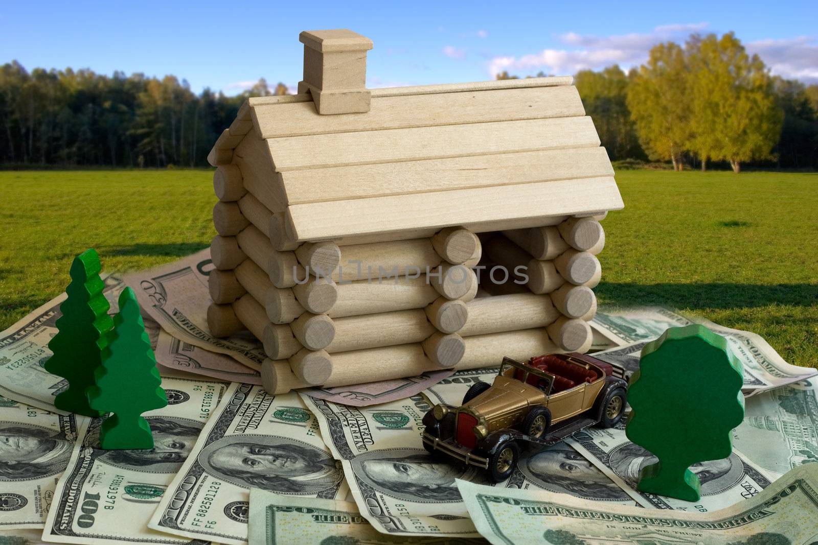 Miniature Log House building model and money dollar bills background