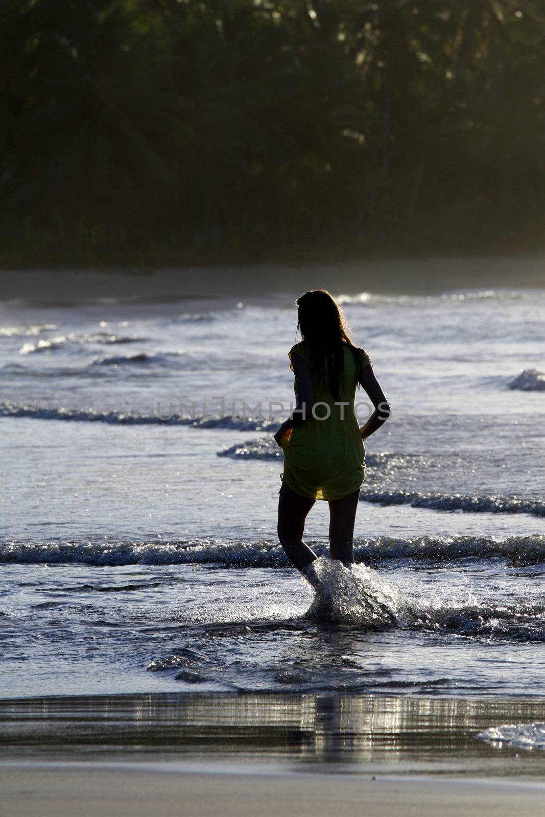 woman silhouette by sunset in the caribbean