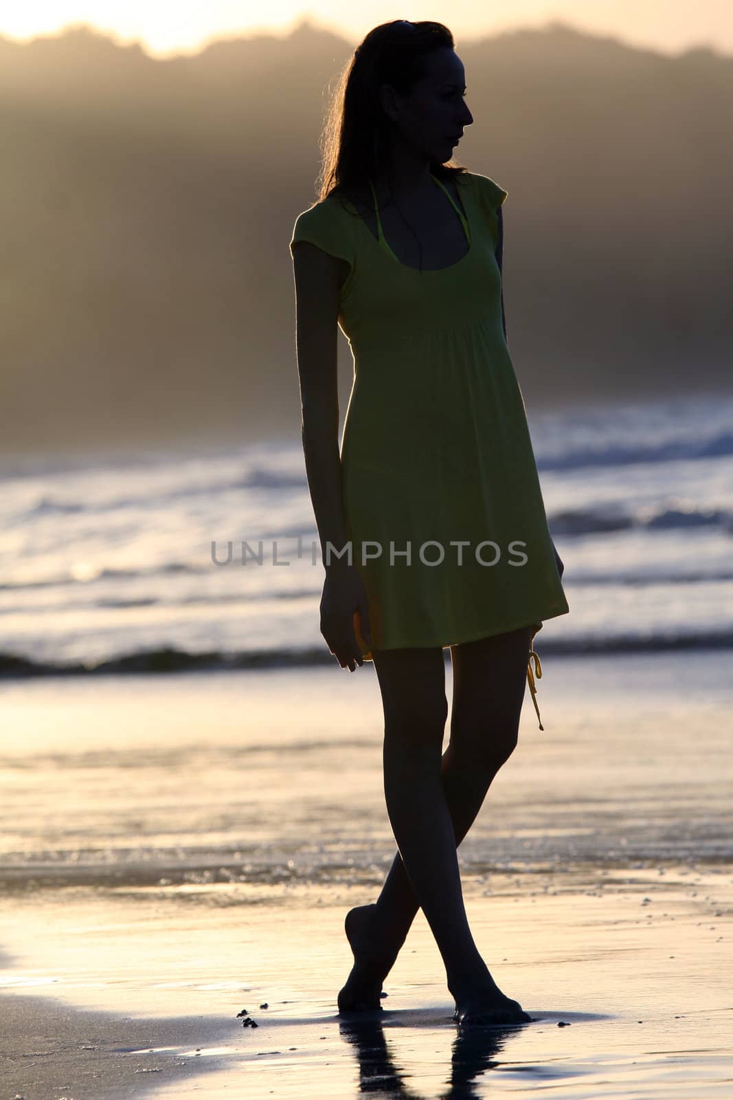 woman silhouette by sunset in the caribbean