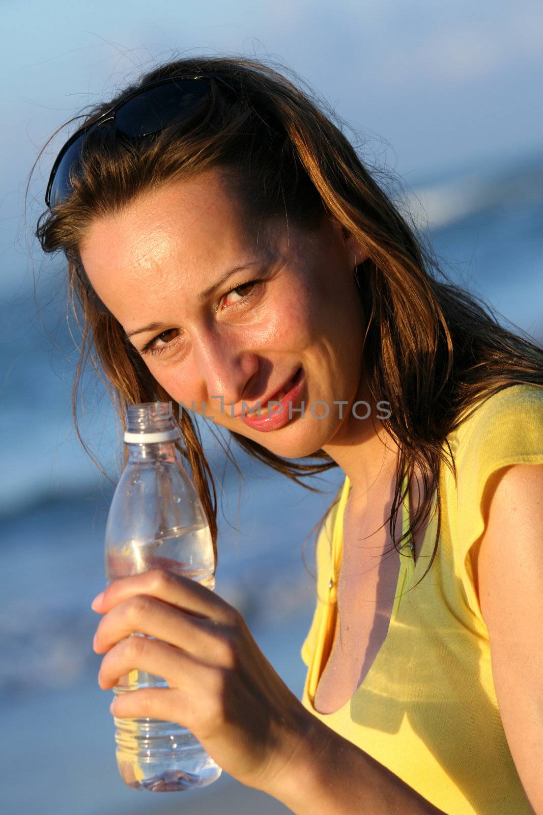 Woman holding a bottle water in her hand