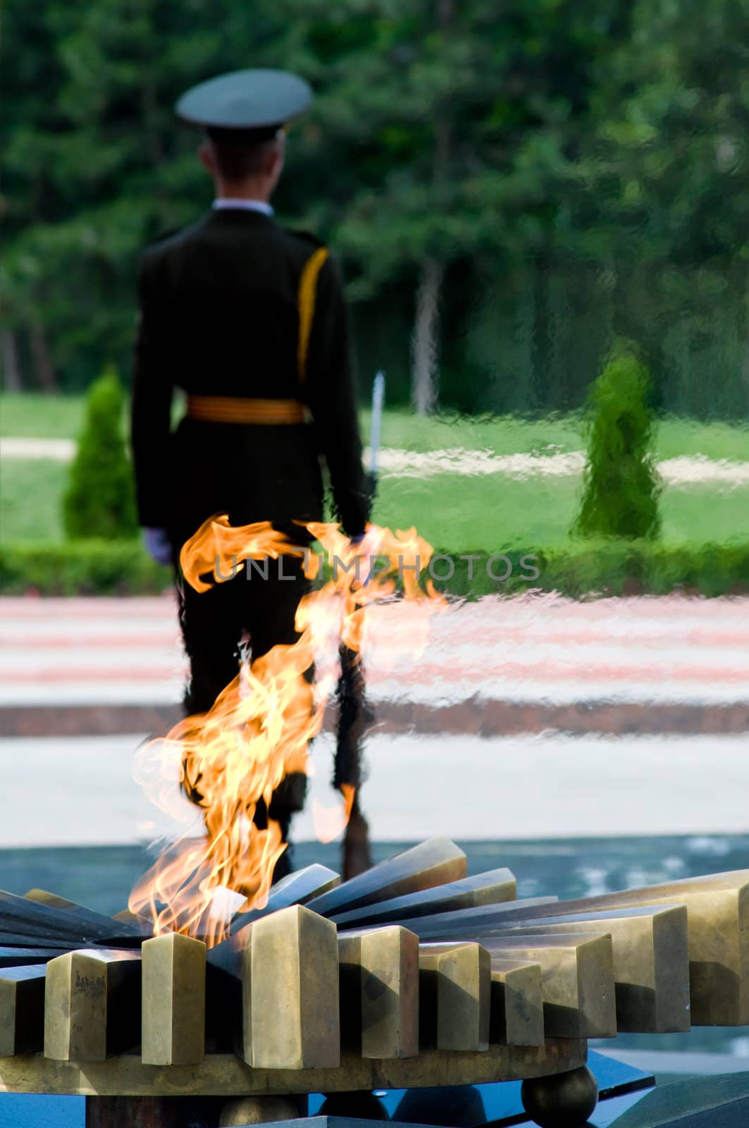 Sentinel and Eternal Flame at the memorial in honour of the Victory in Second World War. Chisinau, Moldova.