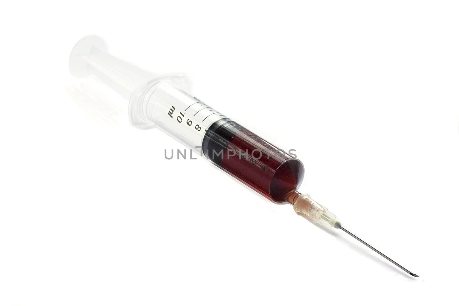 Plastic syringe isolated over a white background.