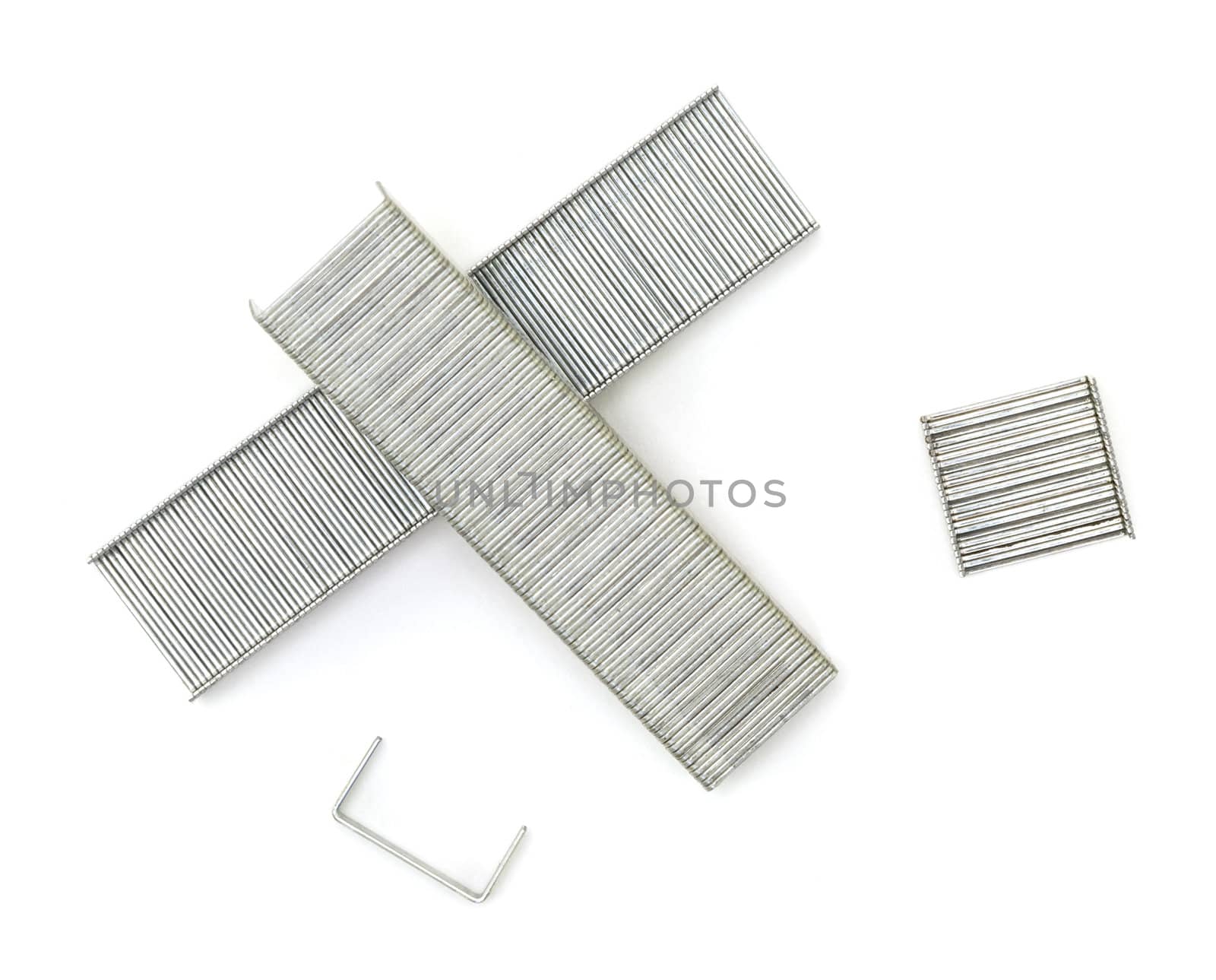 A close up of a collection of staples shot against a white background.