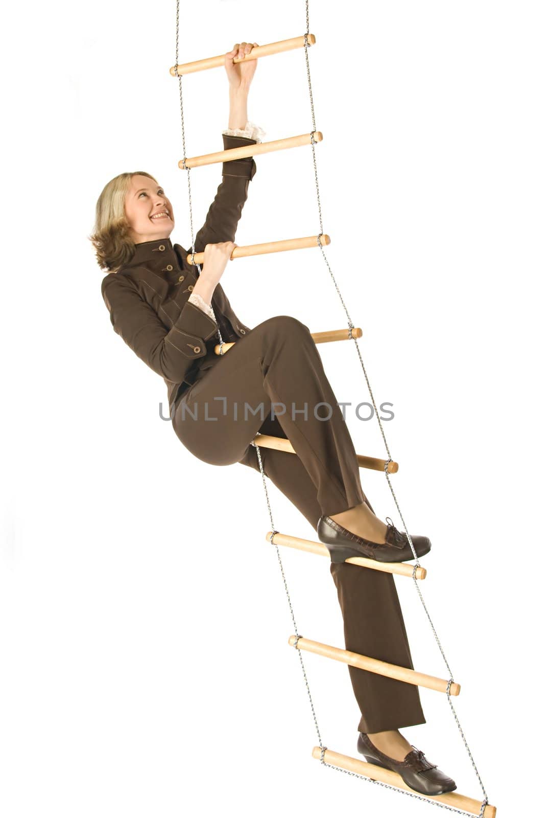 An isolated photo of a businesswoman climbing a rope-ladder