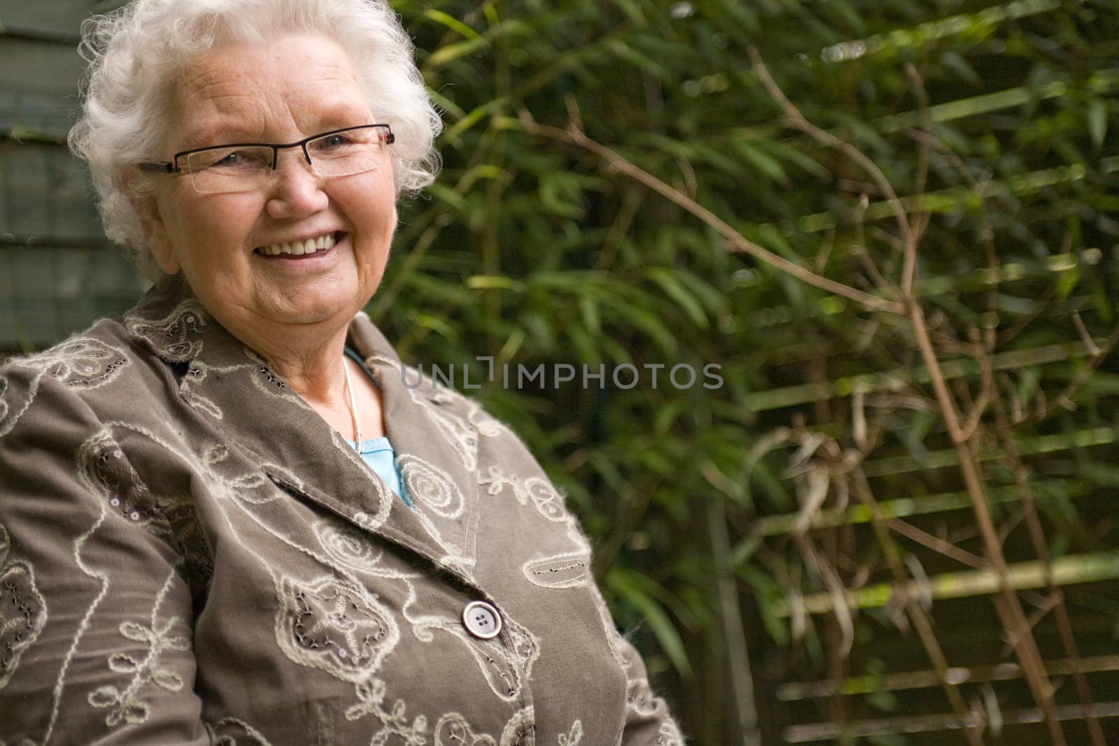 outside portrait of an elderly woman smiling