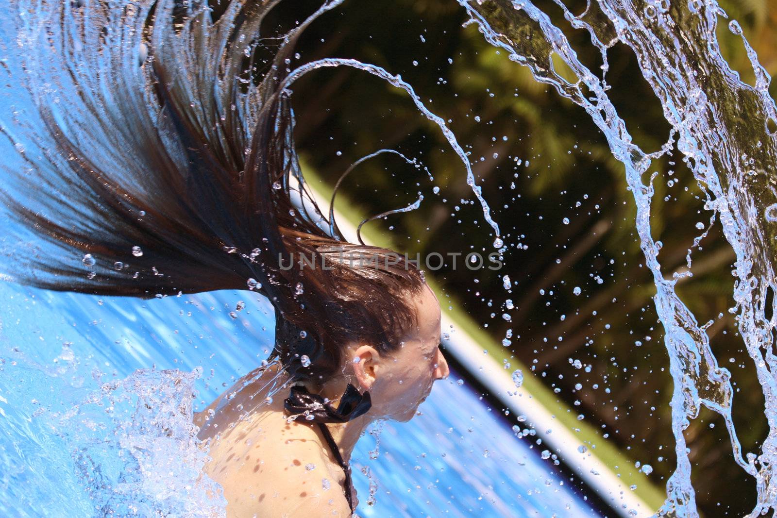 woman takes a bath in the swimming pool