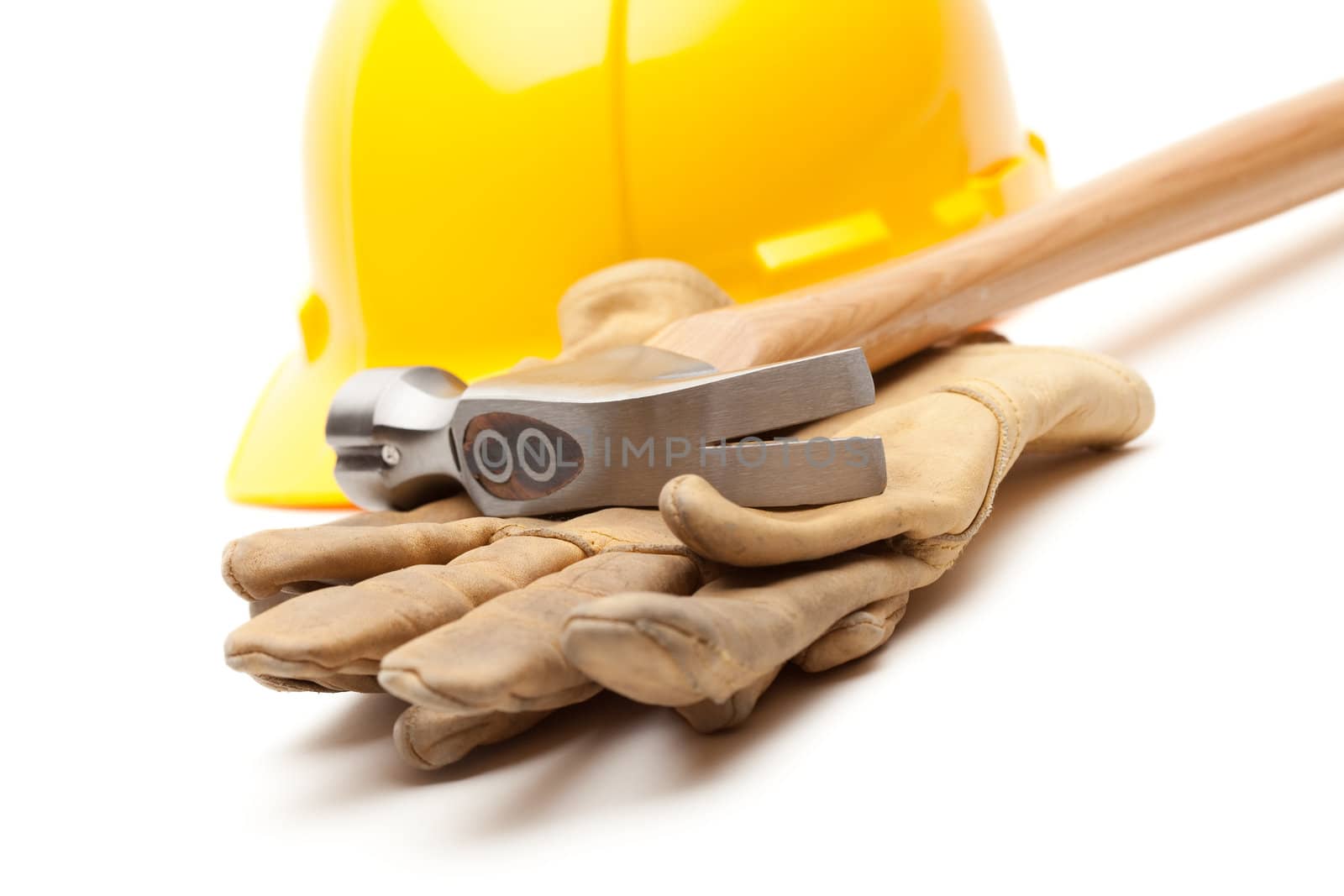 Yellow Hard Hat, Gloves and Hammer Isolated on White.
