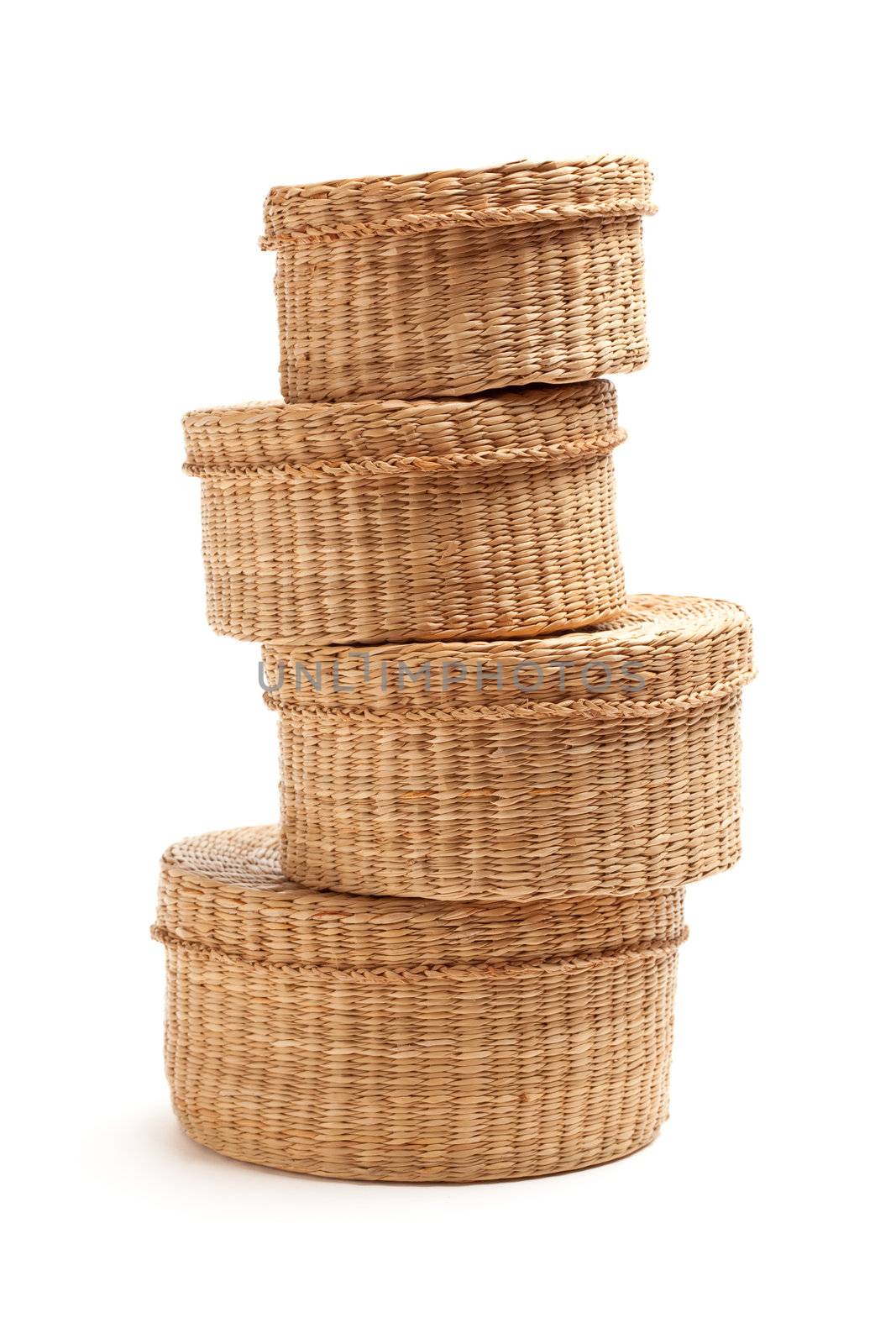 Stack of Various Sized Wicker Baskets Isolated on White.