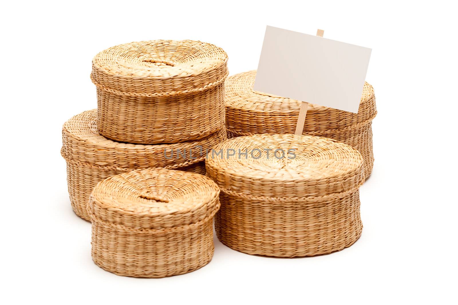 Various Sized Wicker Baskets with Blank Sign Isolated on White.