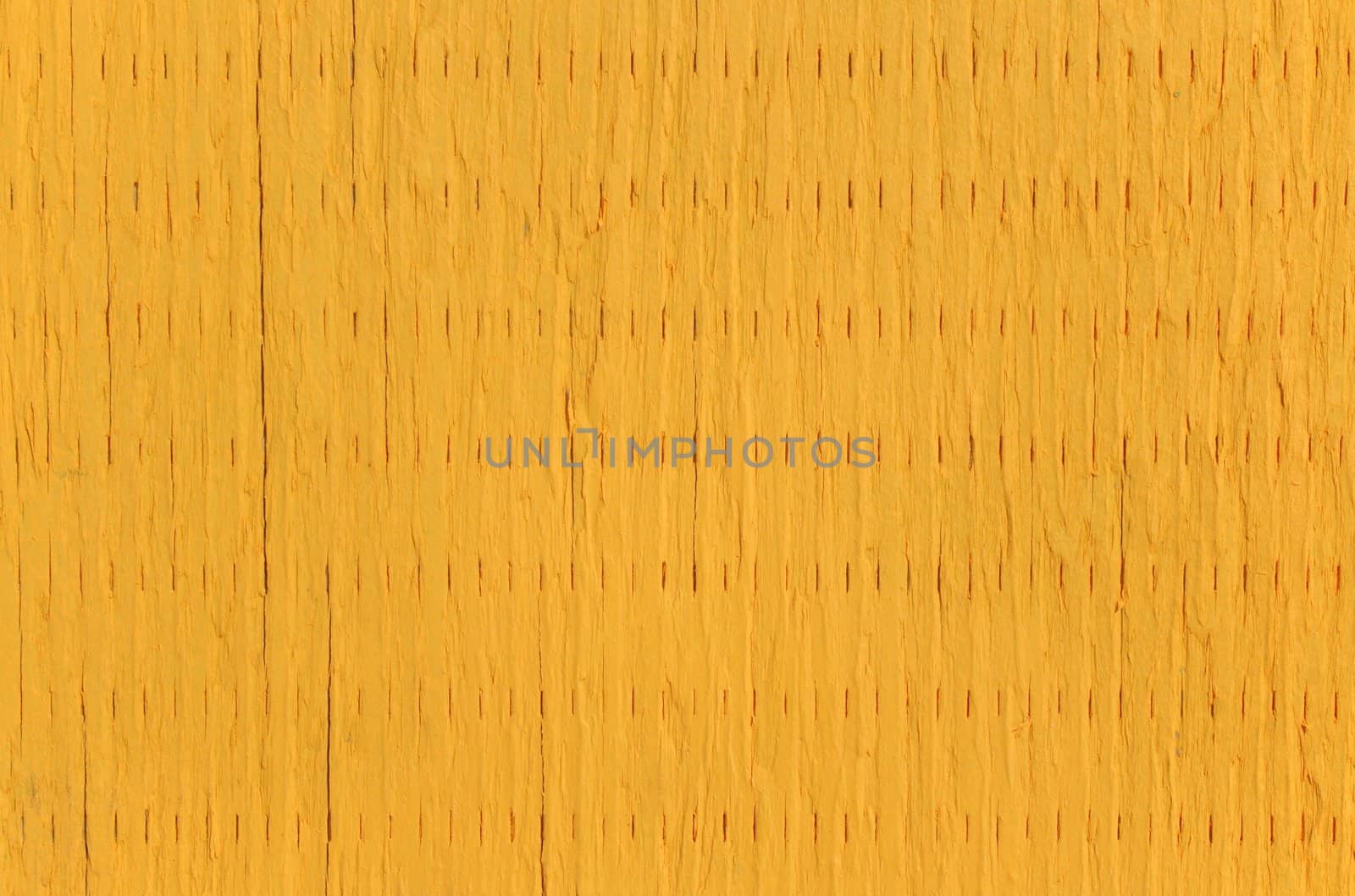 Vibrant background: wooden panel painted in bright yellow color.