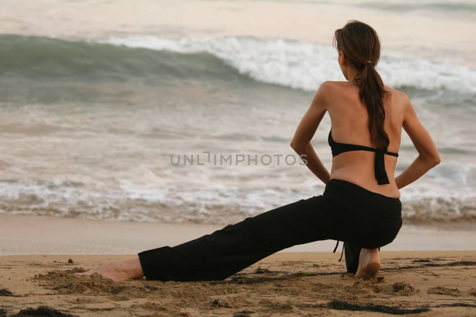 workout and stretching exercises on the beach