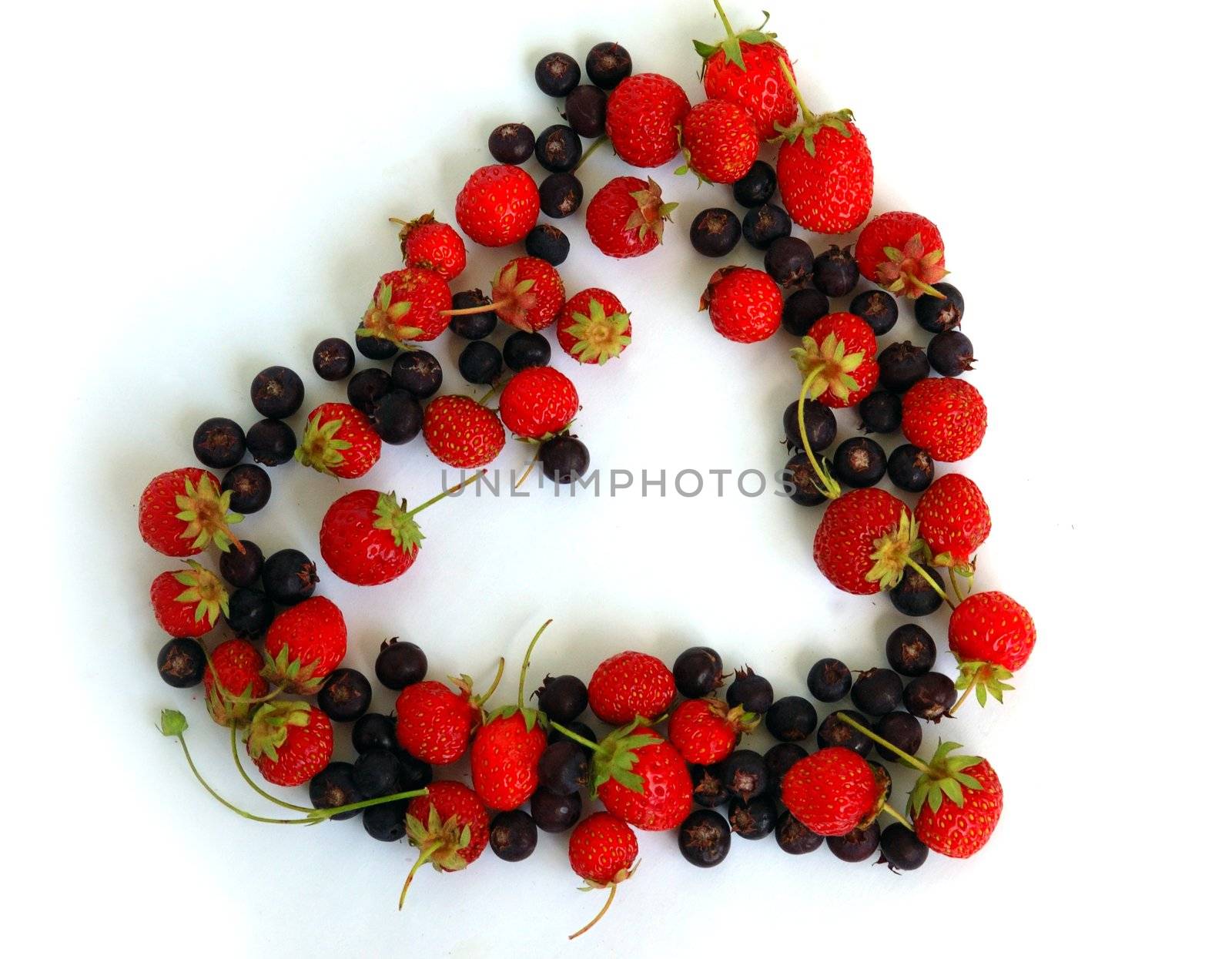 Duality of feelings - heart symbol made of fresh strawberries and bog bilberries