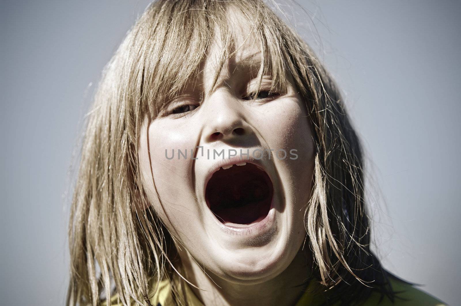 great cross processed style miage of a young girl mouth open yelling