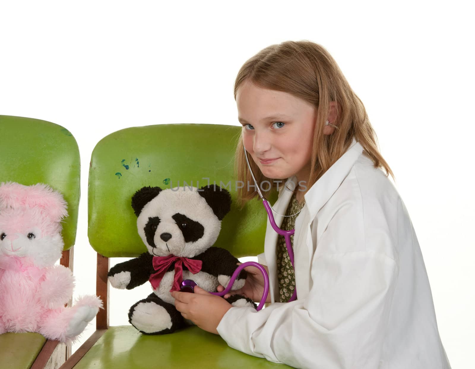 girl playing doctor with her toys by clearviewstock