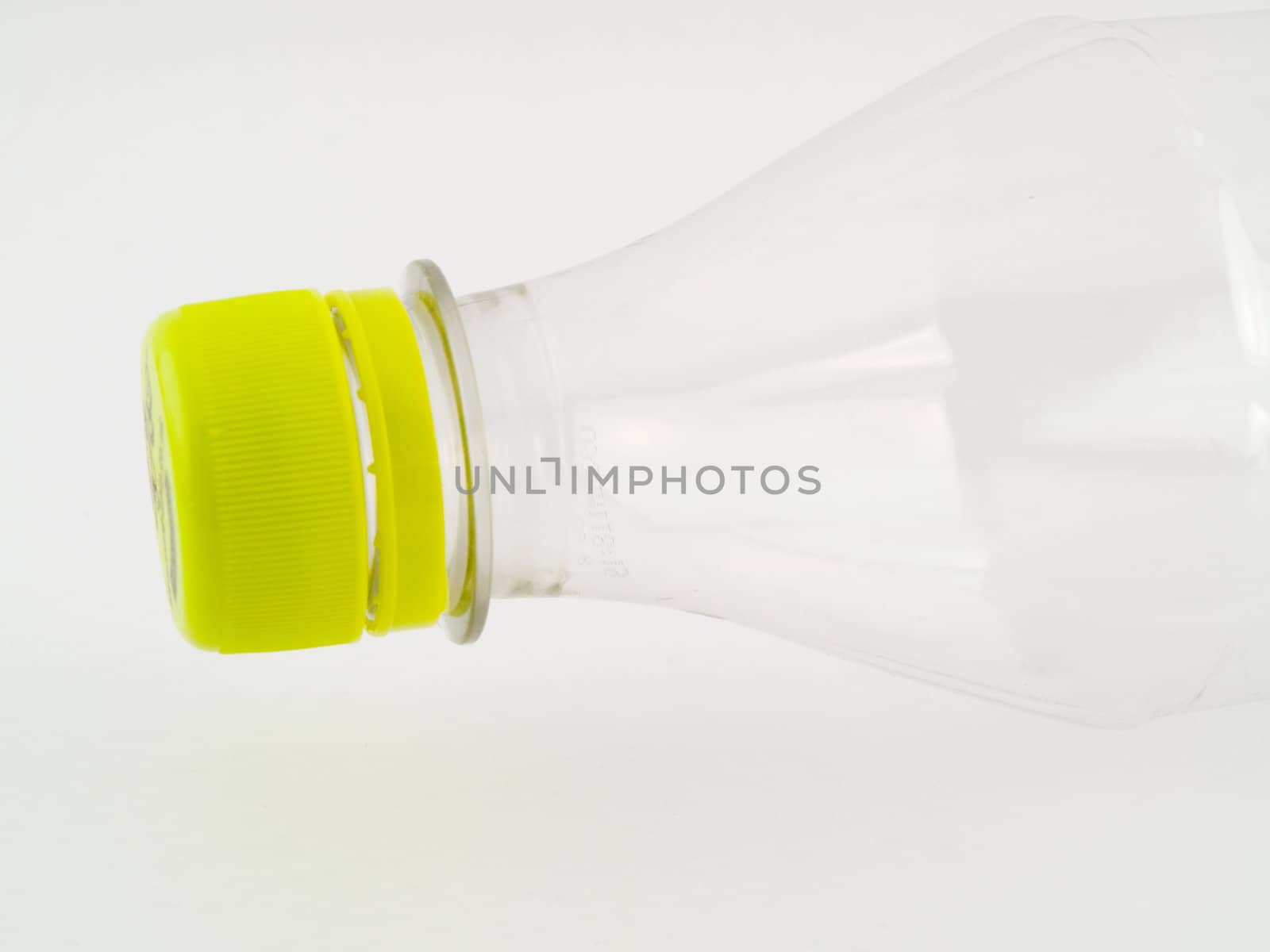 PVCu Plastic Bottle With Green Cap Screwed on Clear Bottle