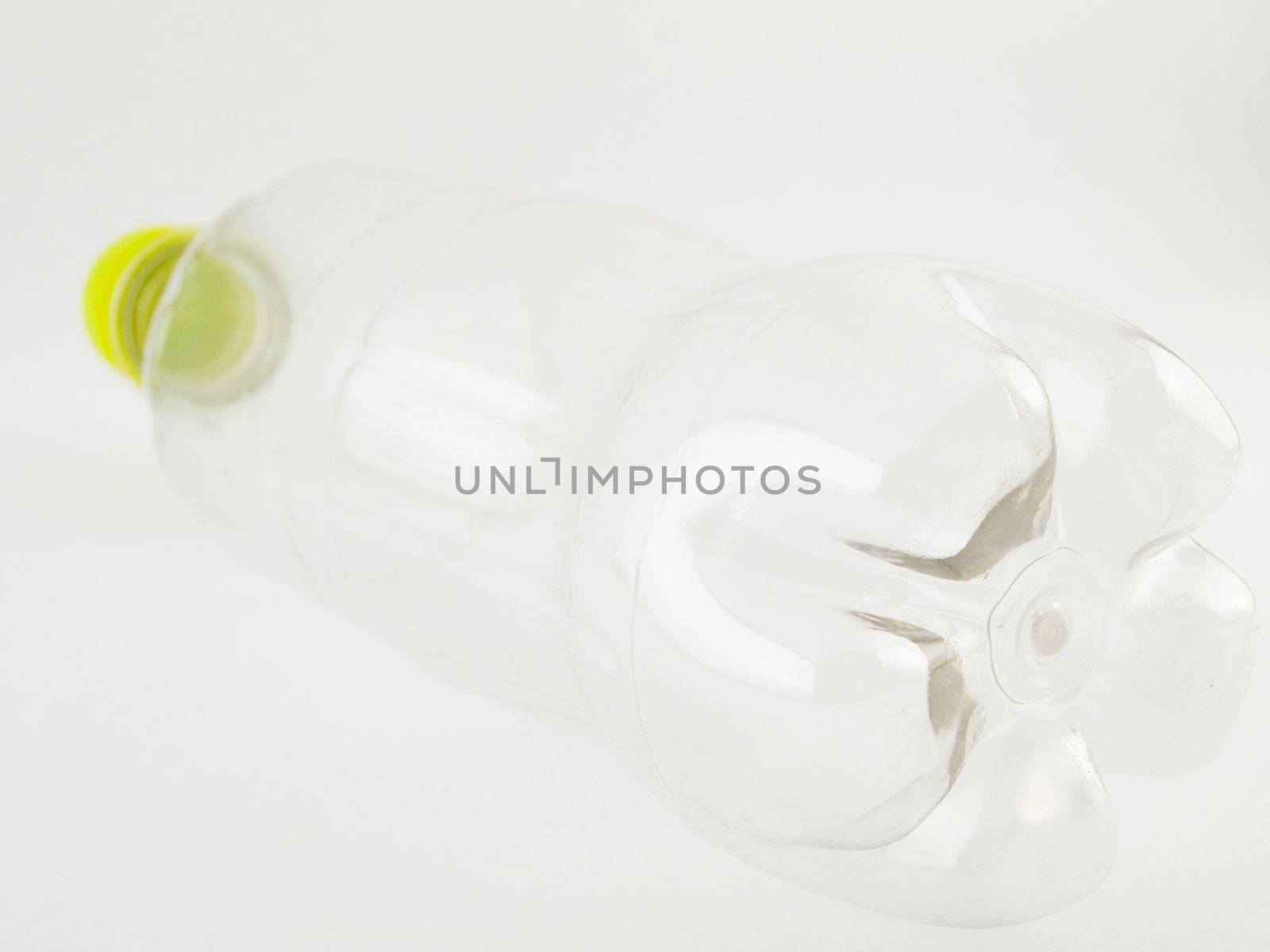 PVCu Plastic Bottle With Green Cap Screwed on Clear Bottle Isometric View Facing Away