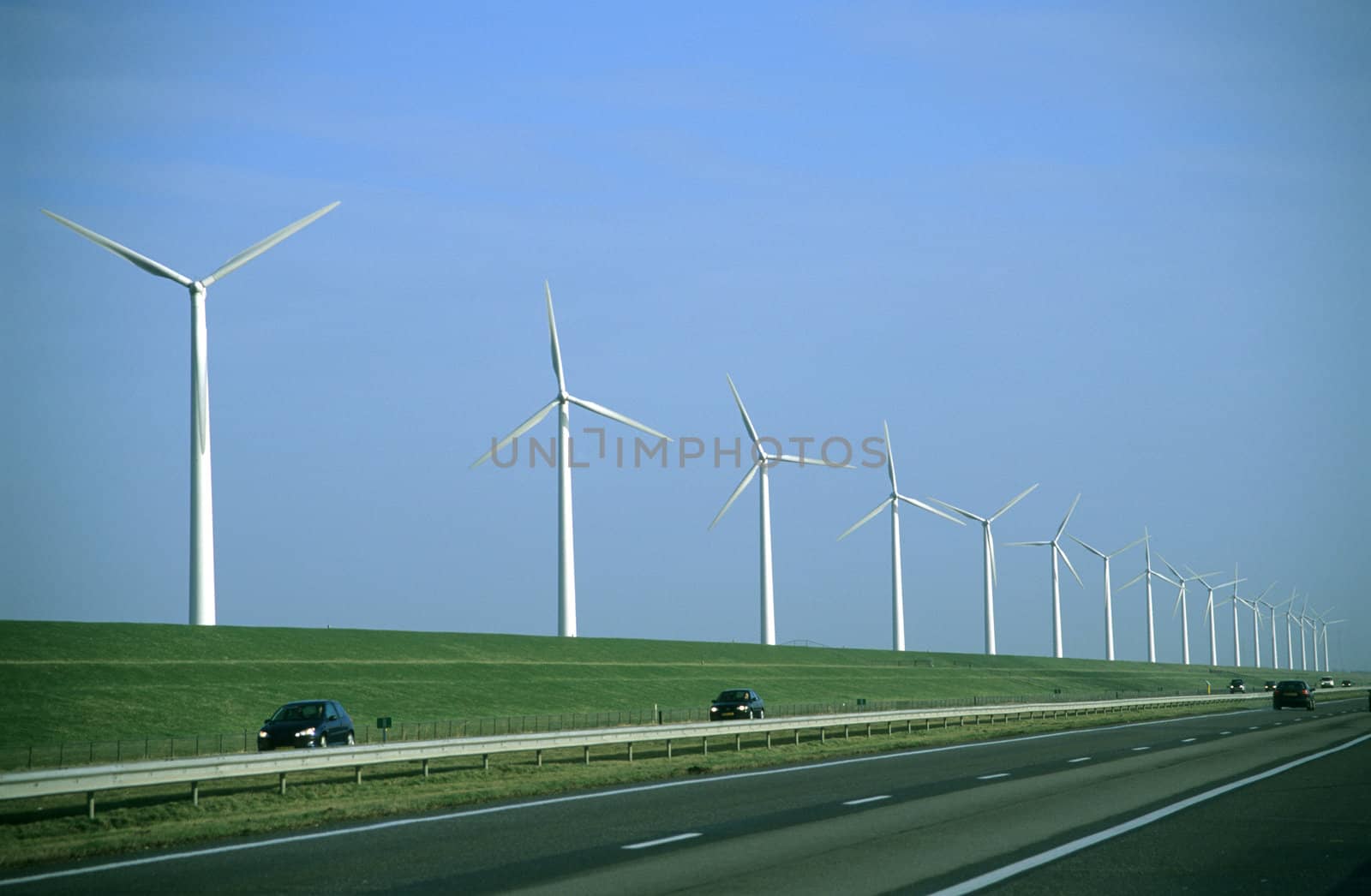 Modern windmills, or wind turbines, dot the lowland countryside of the Netherlands. 