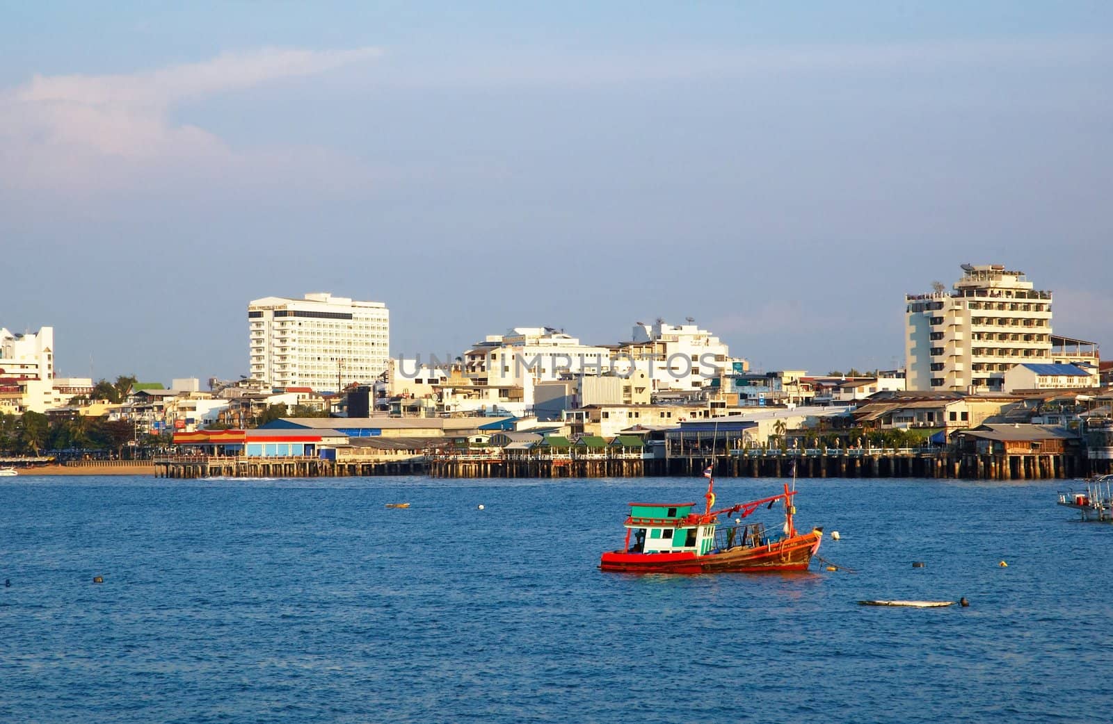 Boats, buildings, beach � modern seacoast urban landscape.