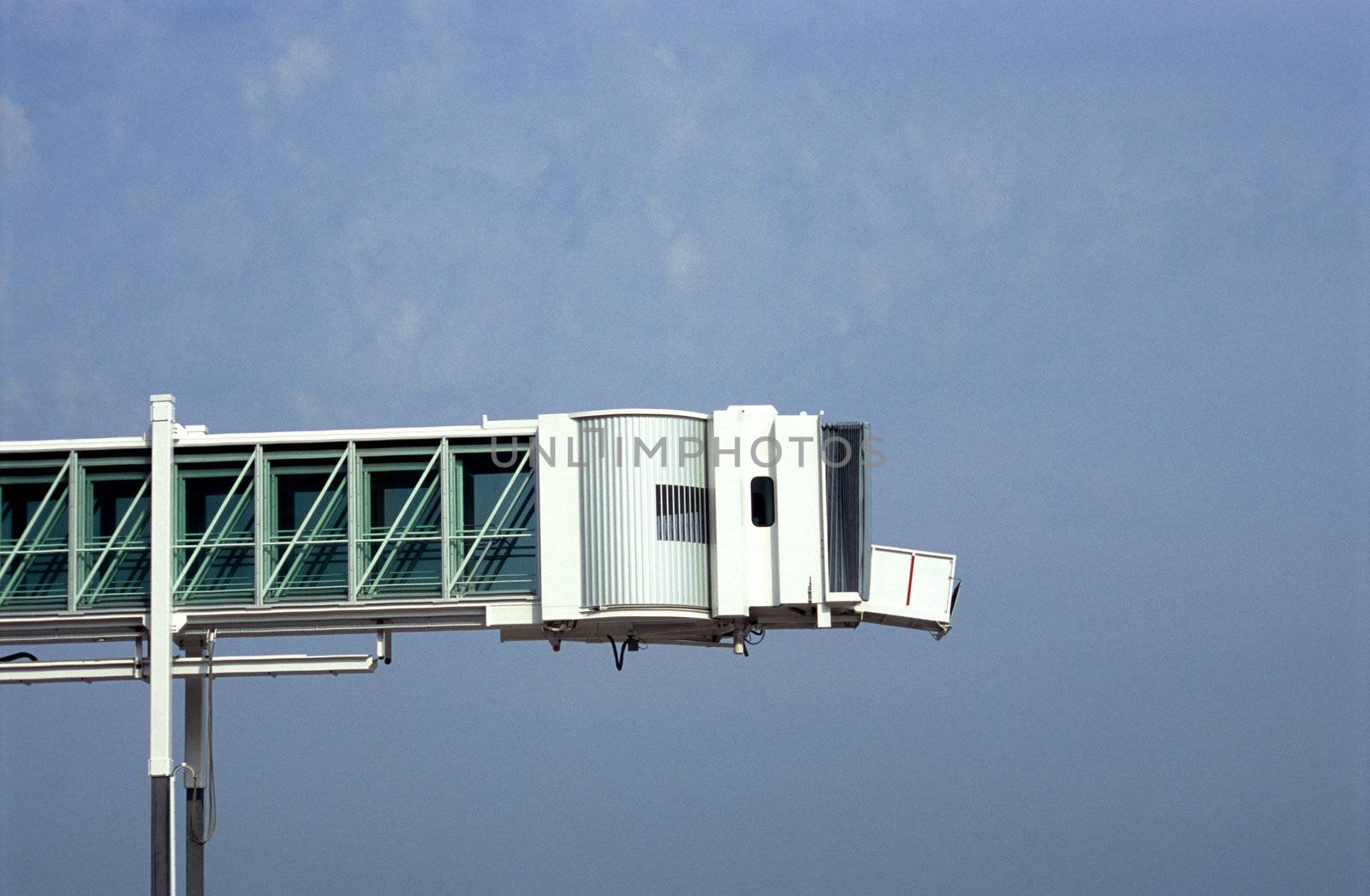 A retracable pedway is used to load and unload passengers from cruise ships and aircraft.