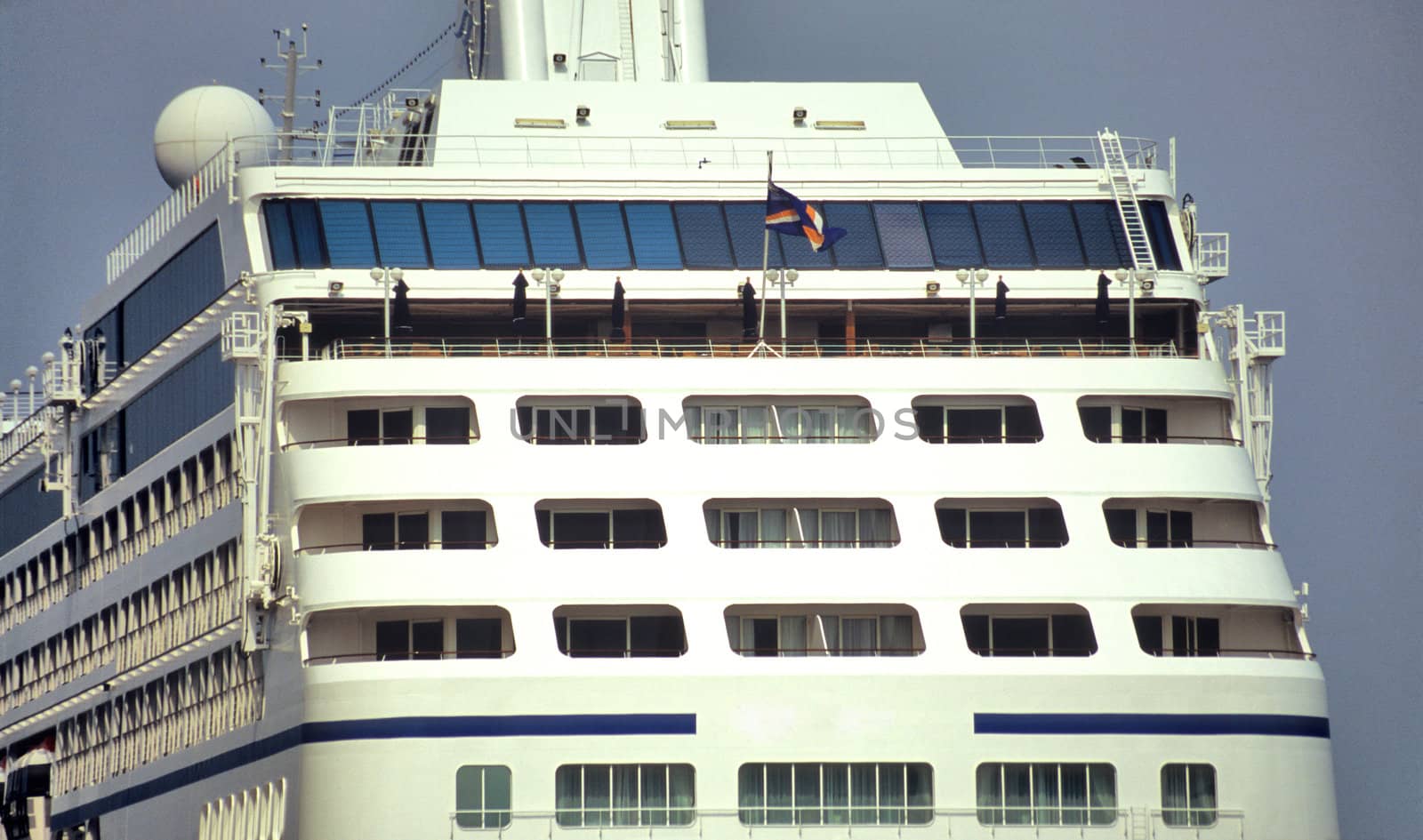Close up of the decks of a cruise ship in port.