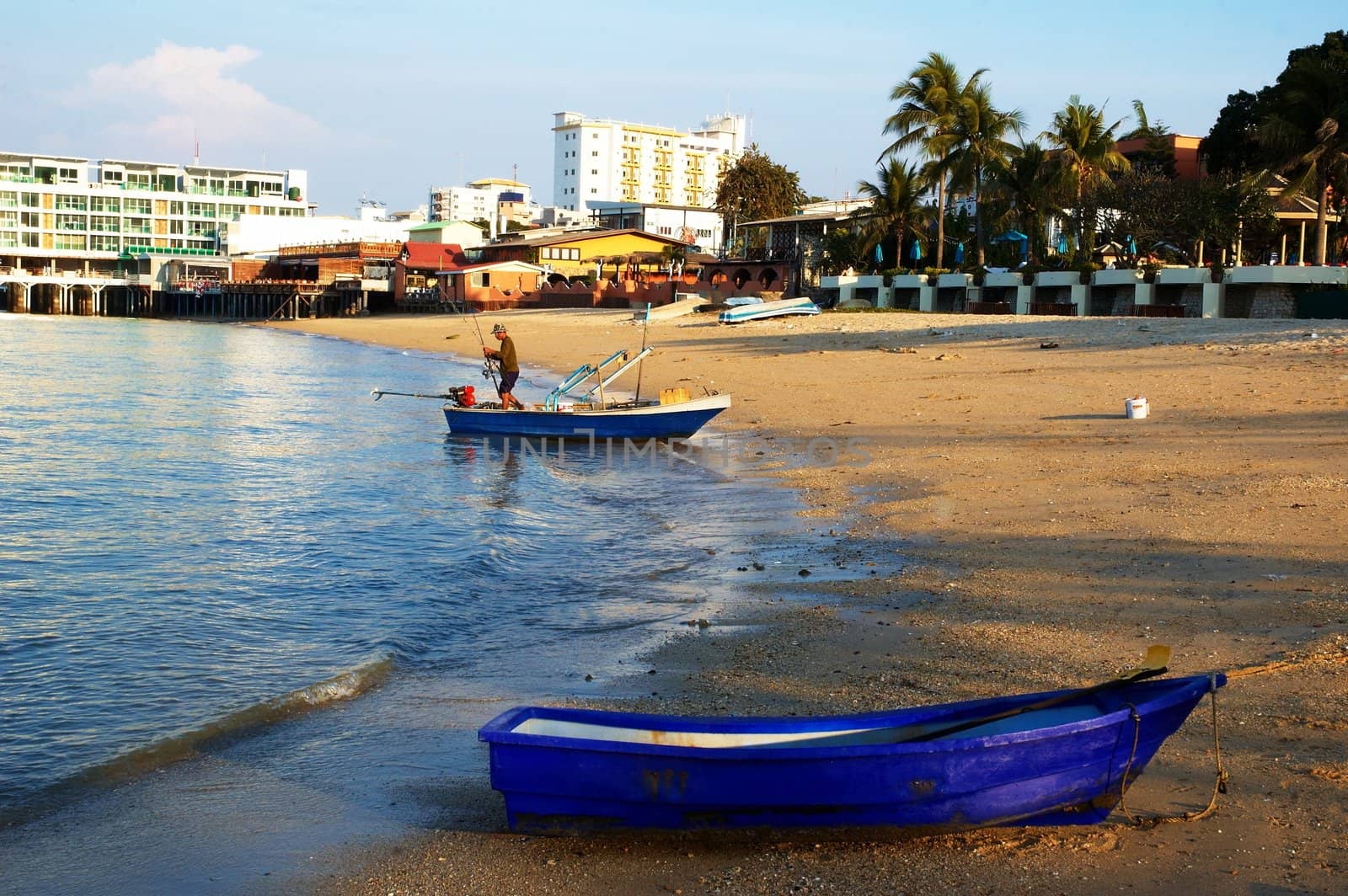 Boats, buildings, beach � modern seacoast urban landscape.