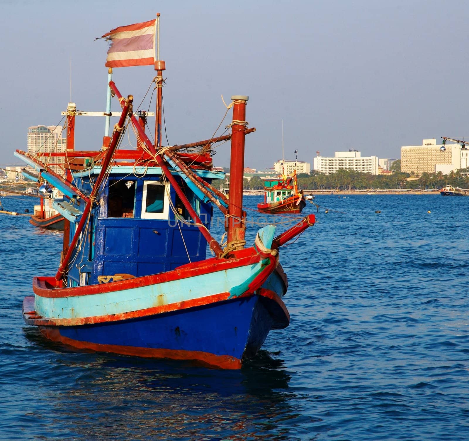 Boats, buildings, beach � modern seacoast urban landscape.