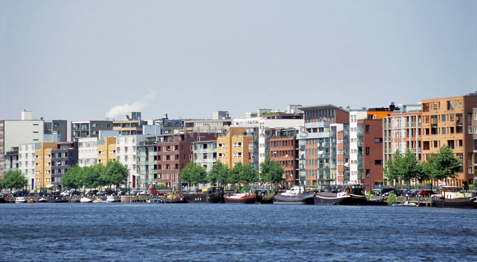 Modern condominiums line the entirely man-made landmass known as Java Island in Amsterdam.