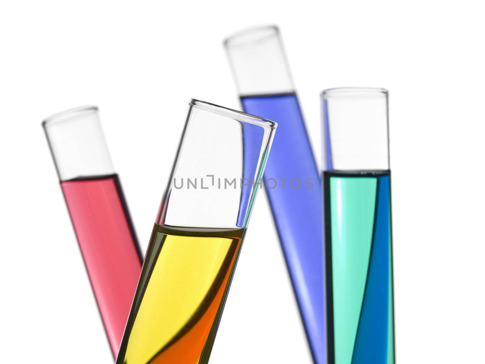 Four test tubes filled with colored liquids. Isolated on white.