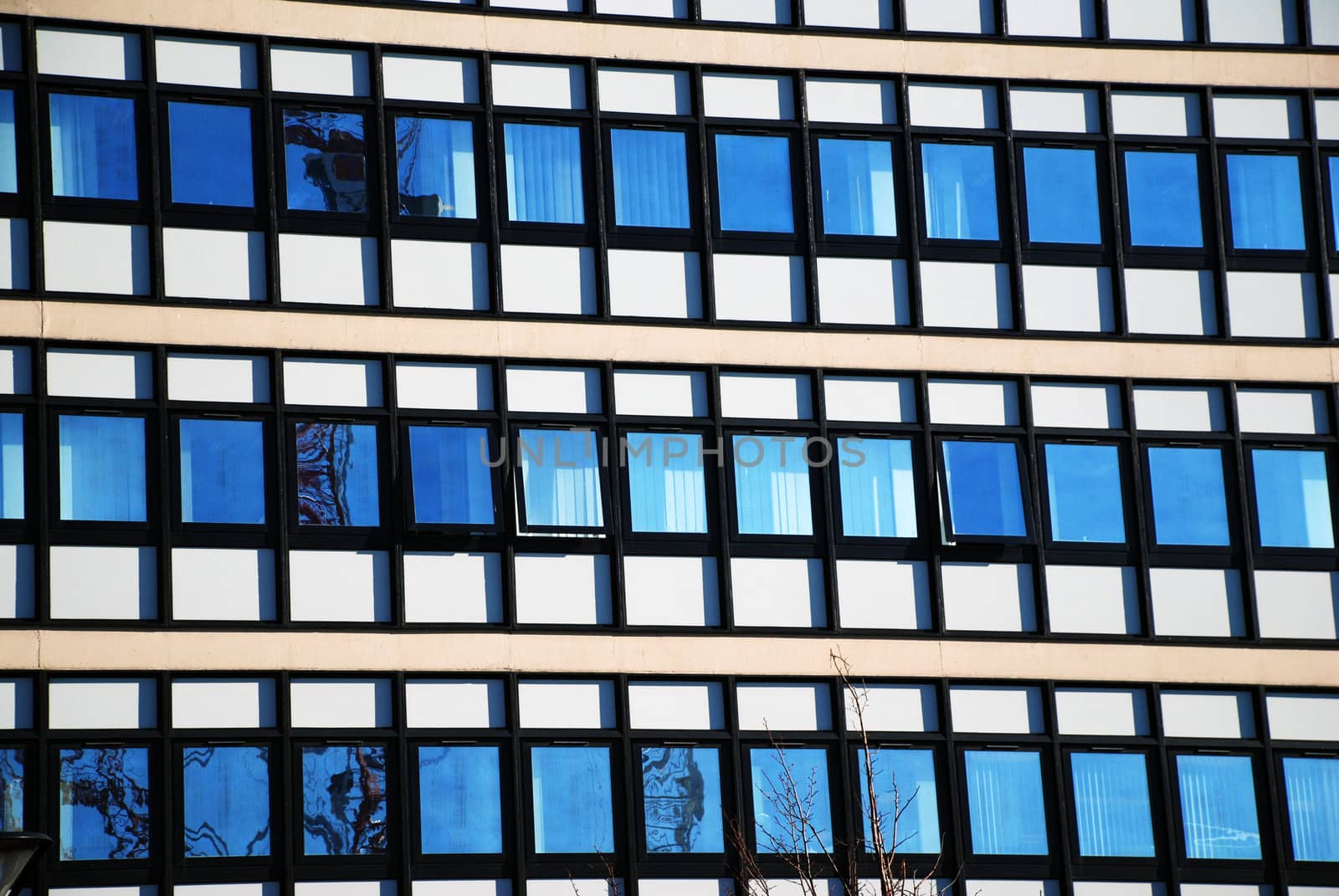 Modern Office Building with Window Reflections by pwillitts