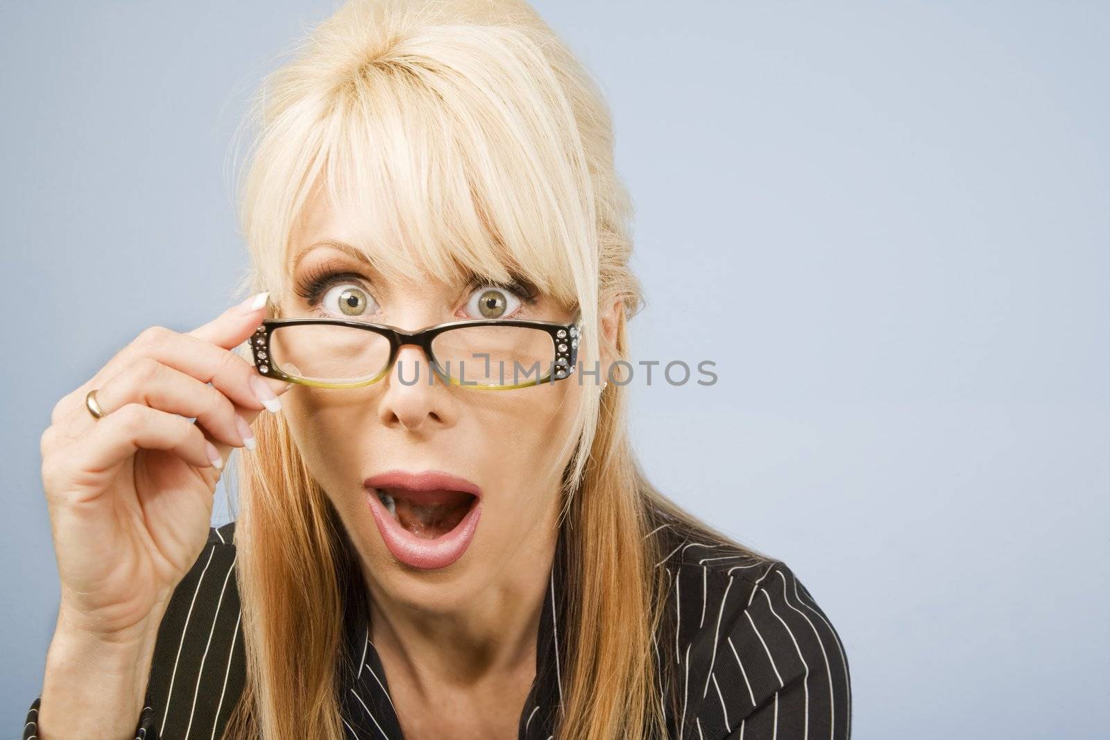 Businesswoman looking over the top of her glasses