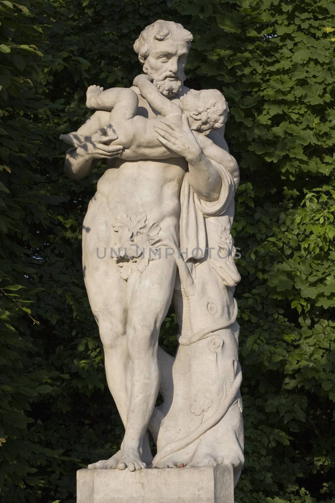 monument of an old man with a child on his hands