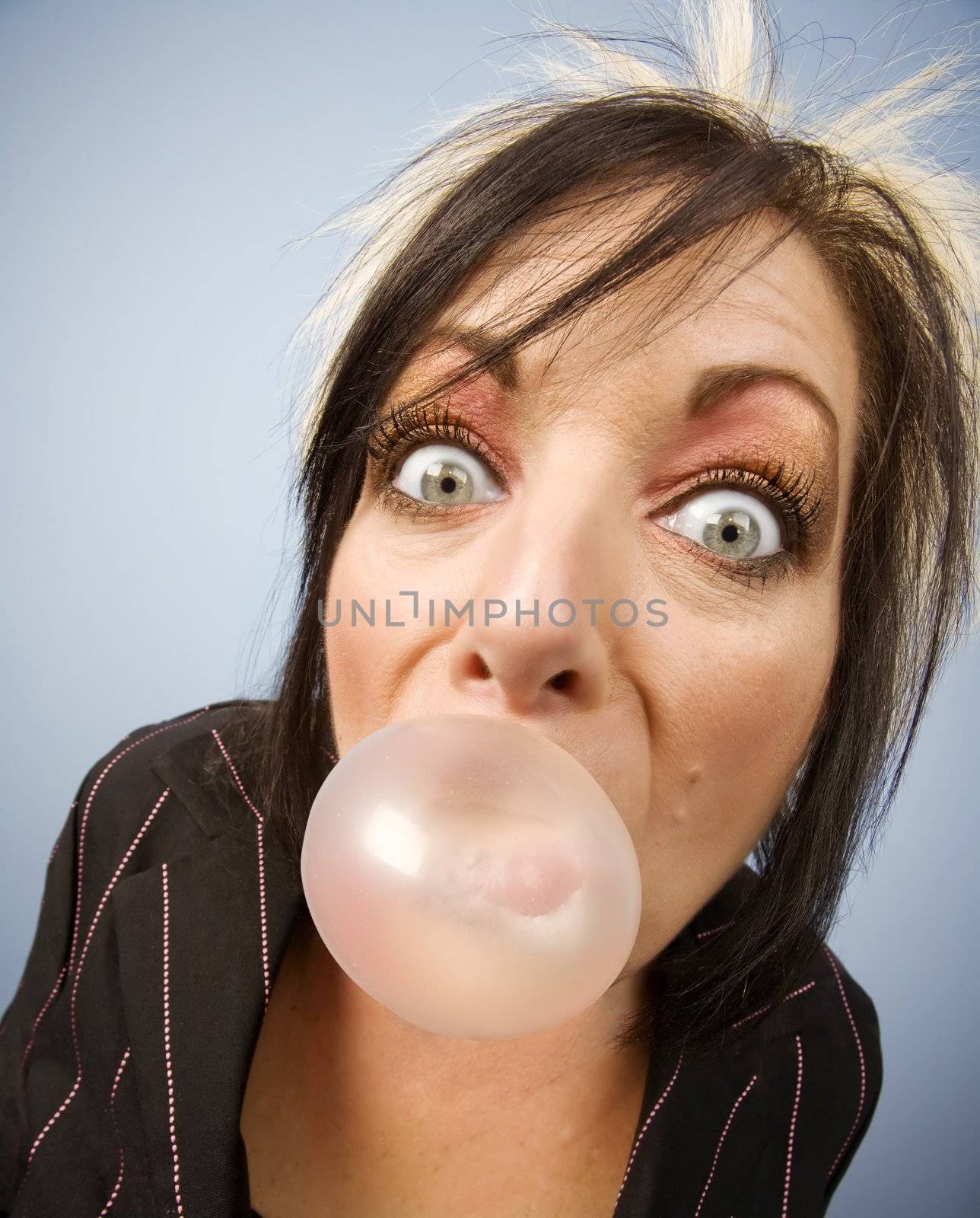 Woman blowing a bubble by Creatista