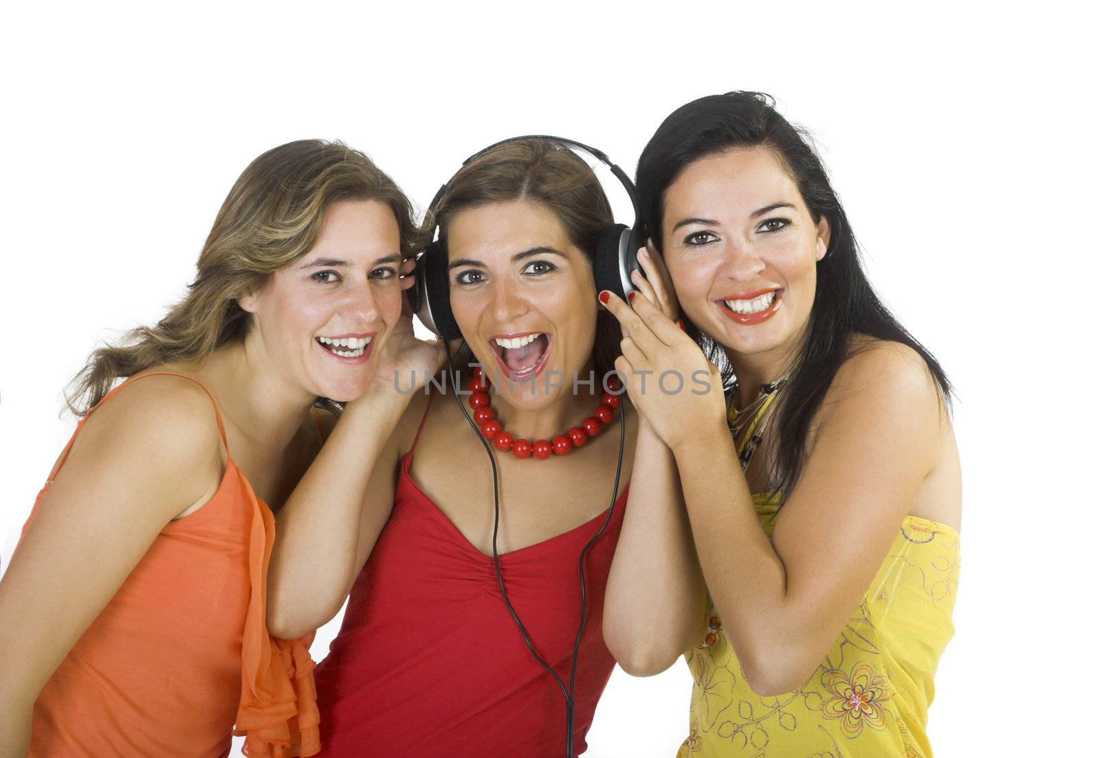 Portrait of three happy girls listening music
  