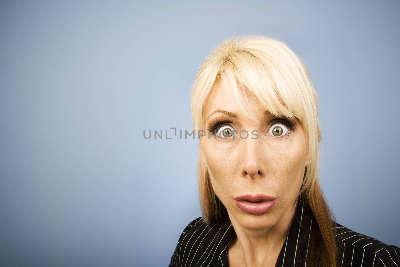 Businesswoman in a pinstripe suit making a funny face