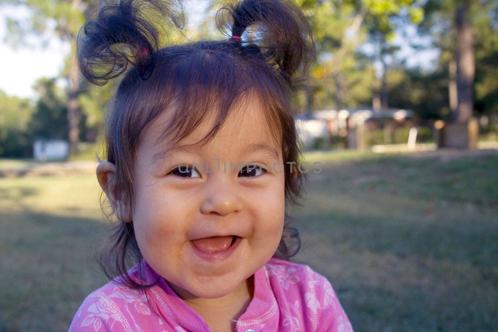 Laughing hispanic girl by mahnken