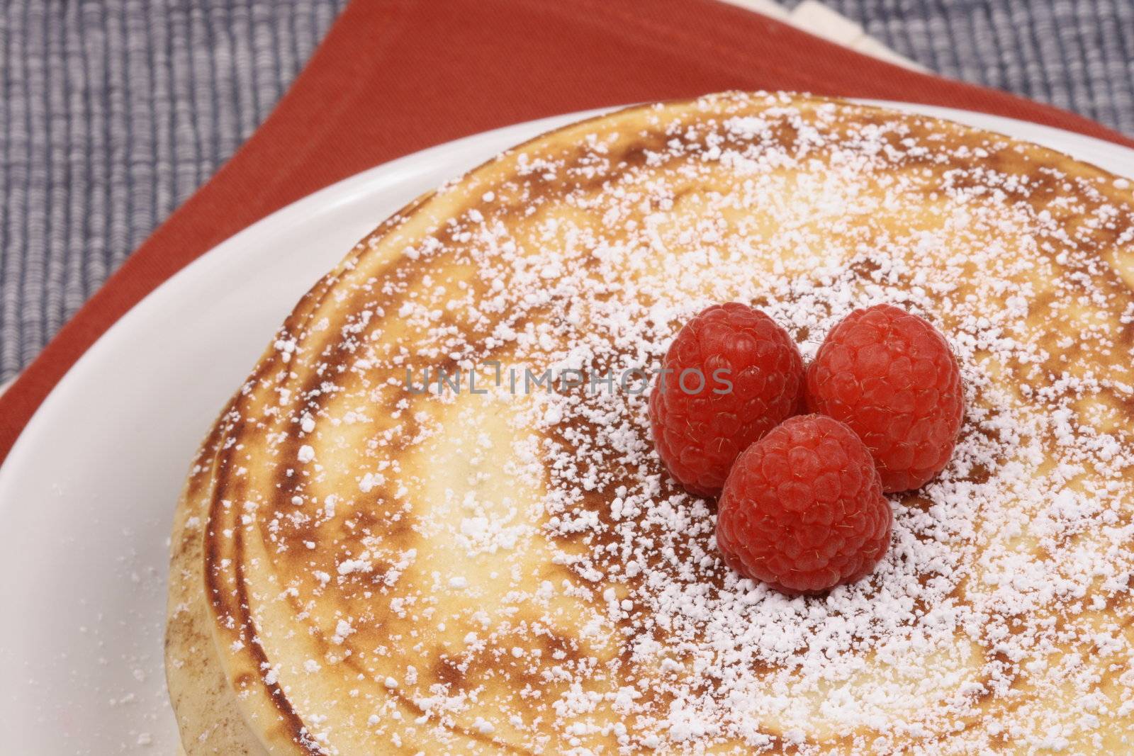 pancakes garnished with berries by tacar