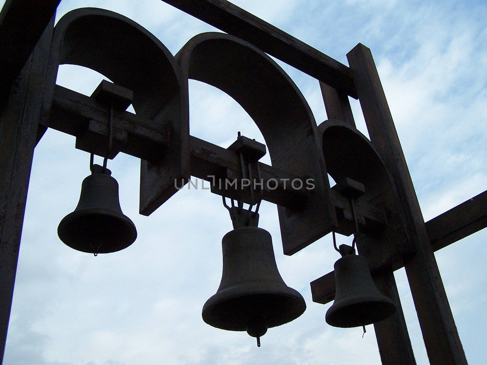 Tree black metalic bells. Ukraine. Kyiv. Day.