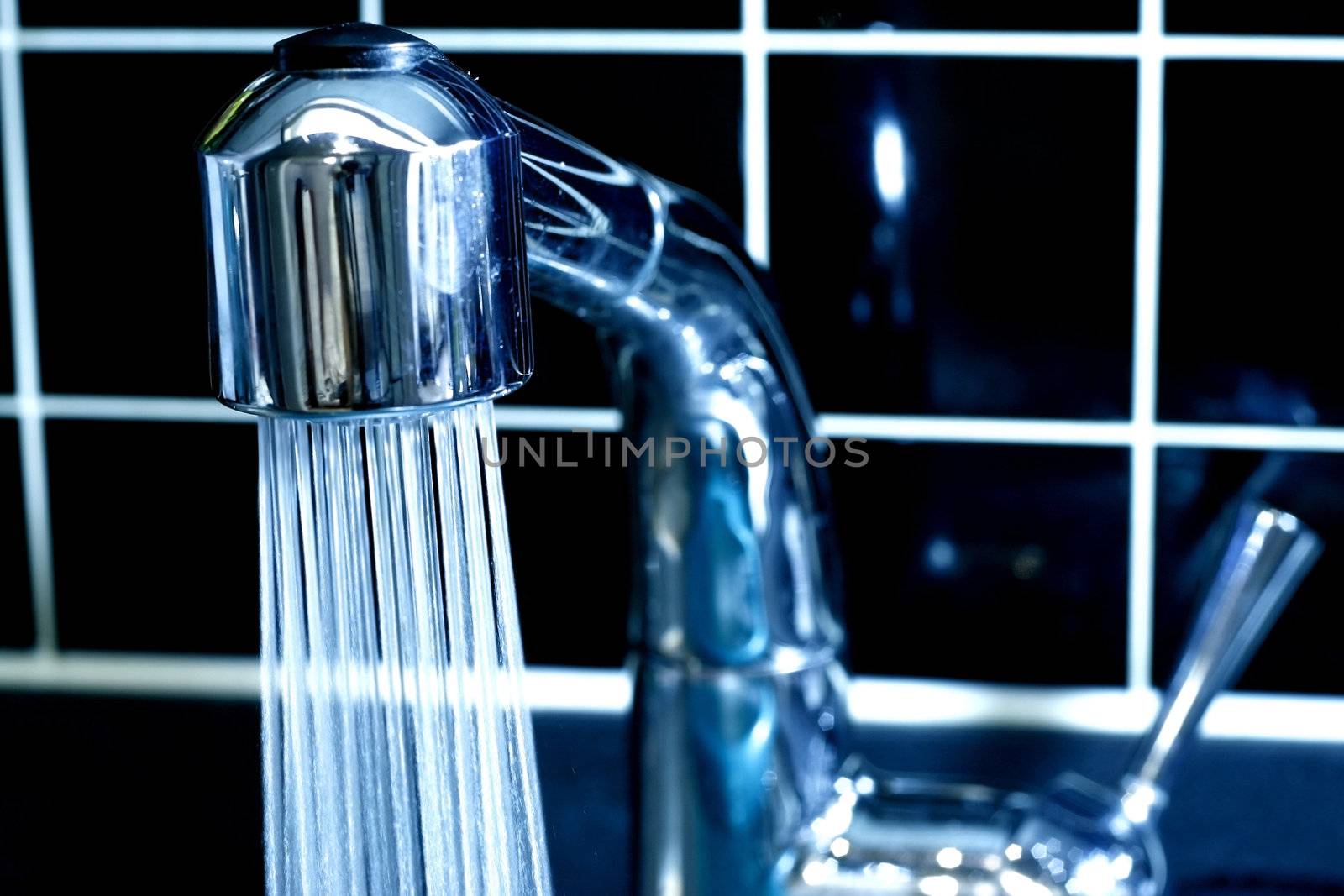 Modern Faucet in Monochrome Color with running Water