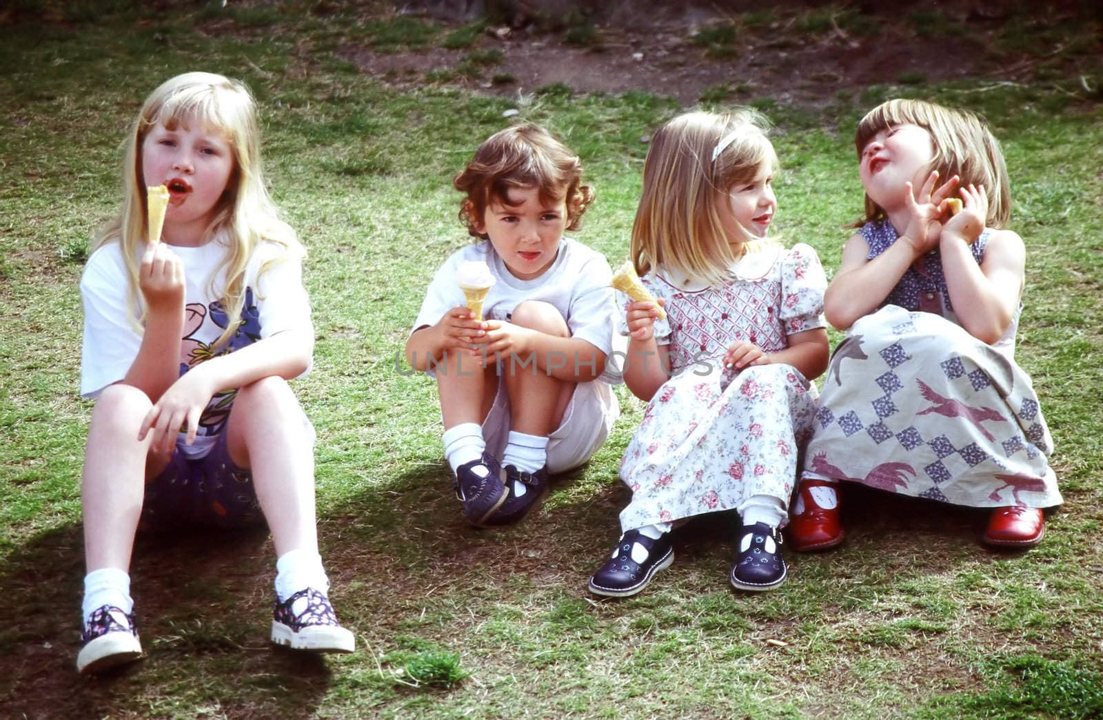 Kids eating ice cream together.