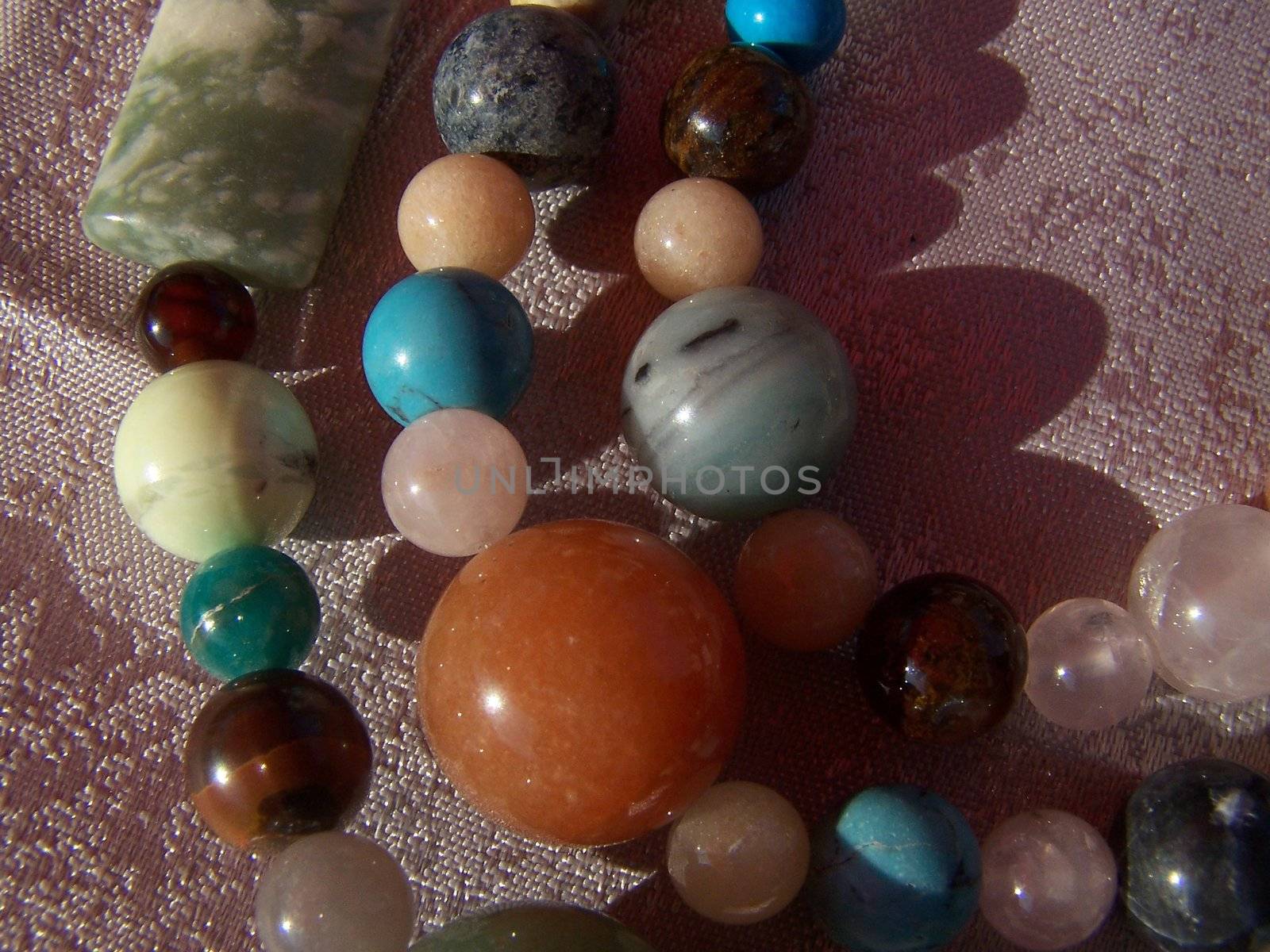 Different colors of gem beads. Close up.