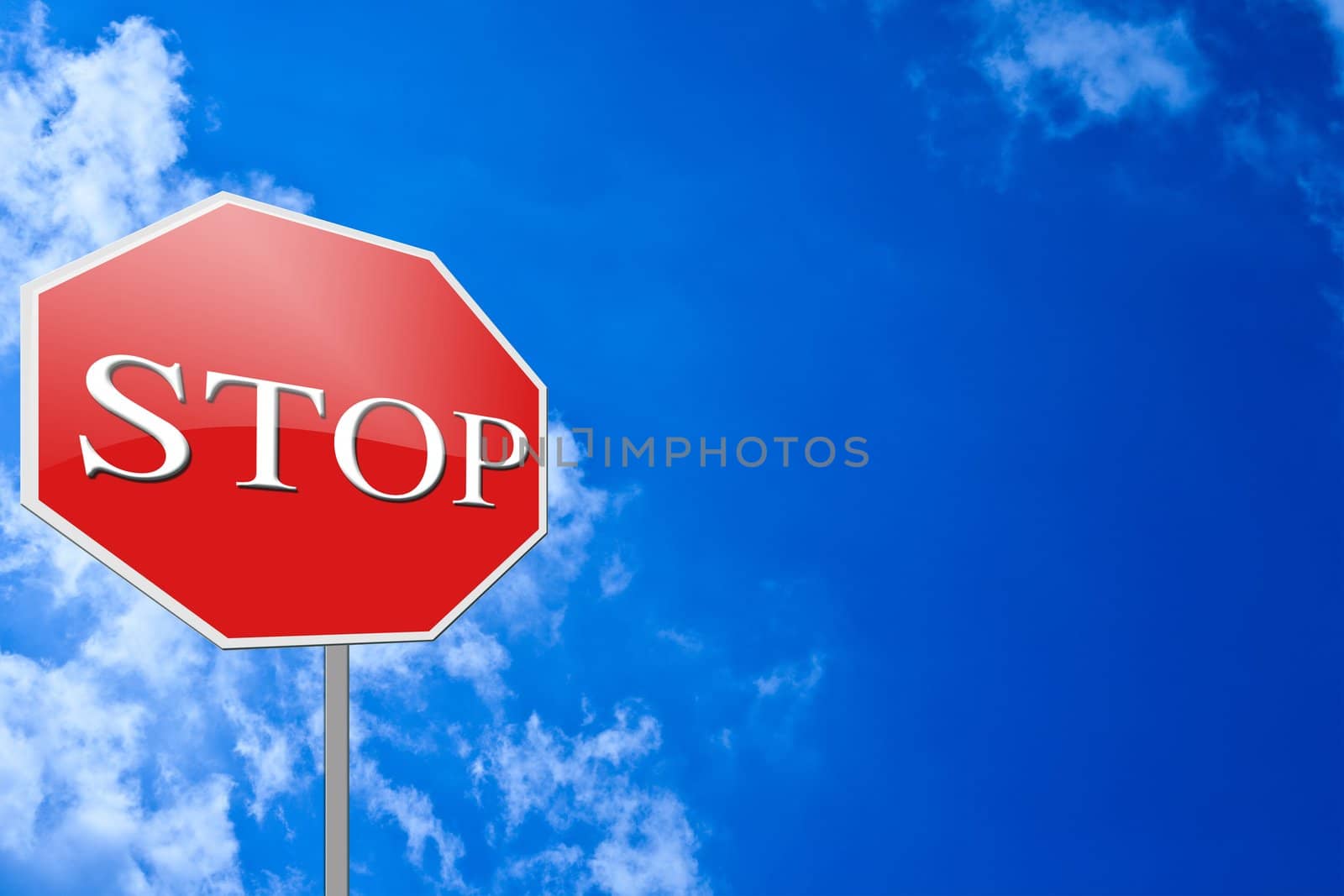Red stop sign on blue sky background