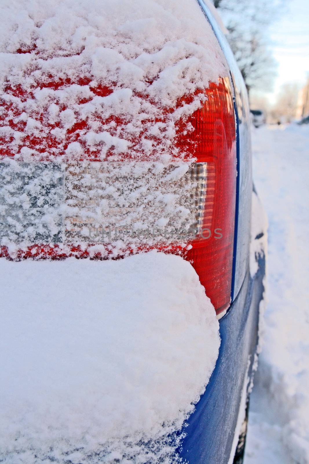 Car bumper covered by snow after the snowstorm.