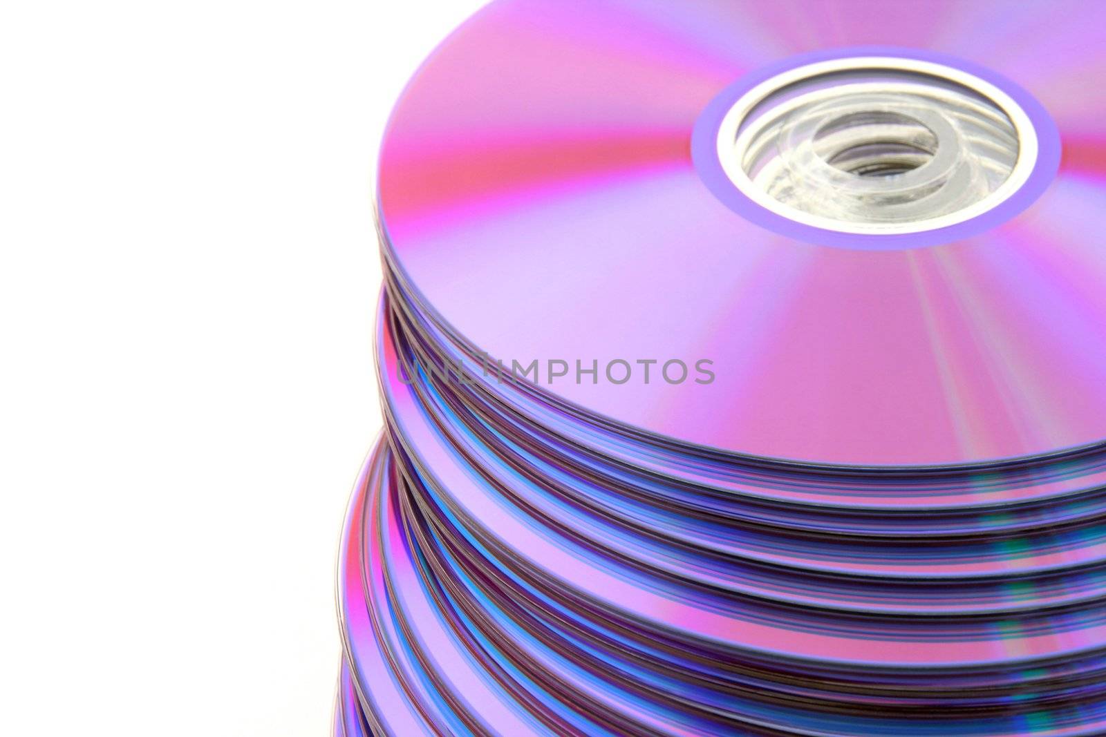 Stacked colorful DVDs or CDs isolated on white background. No dust.