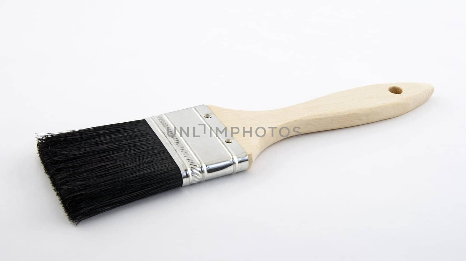 New paint brush with wooden handle.