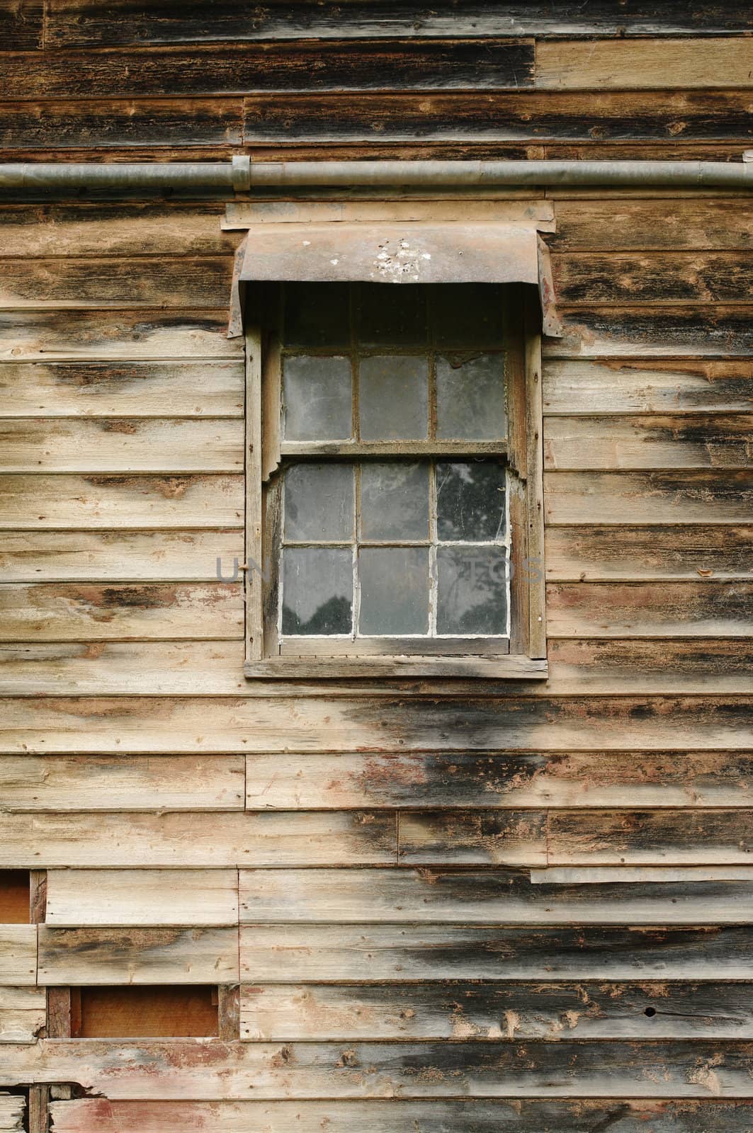 image of an old grungy wooden wall and window