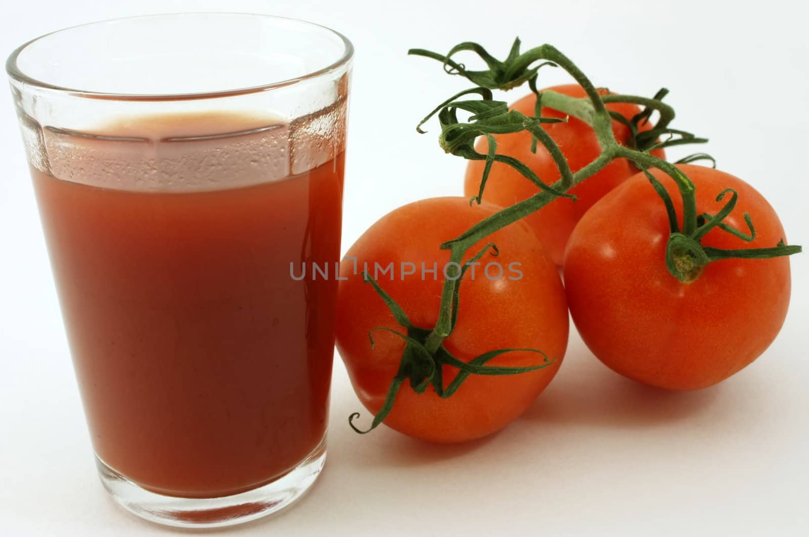 Fresh organic tomatoes and juice combination, isolated