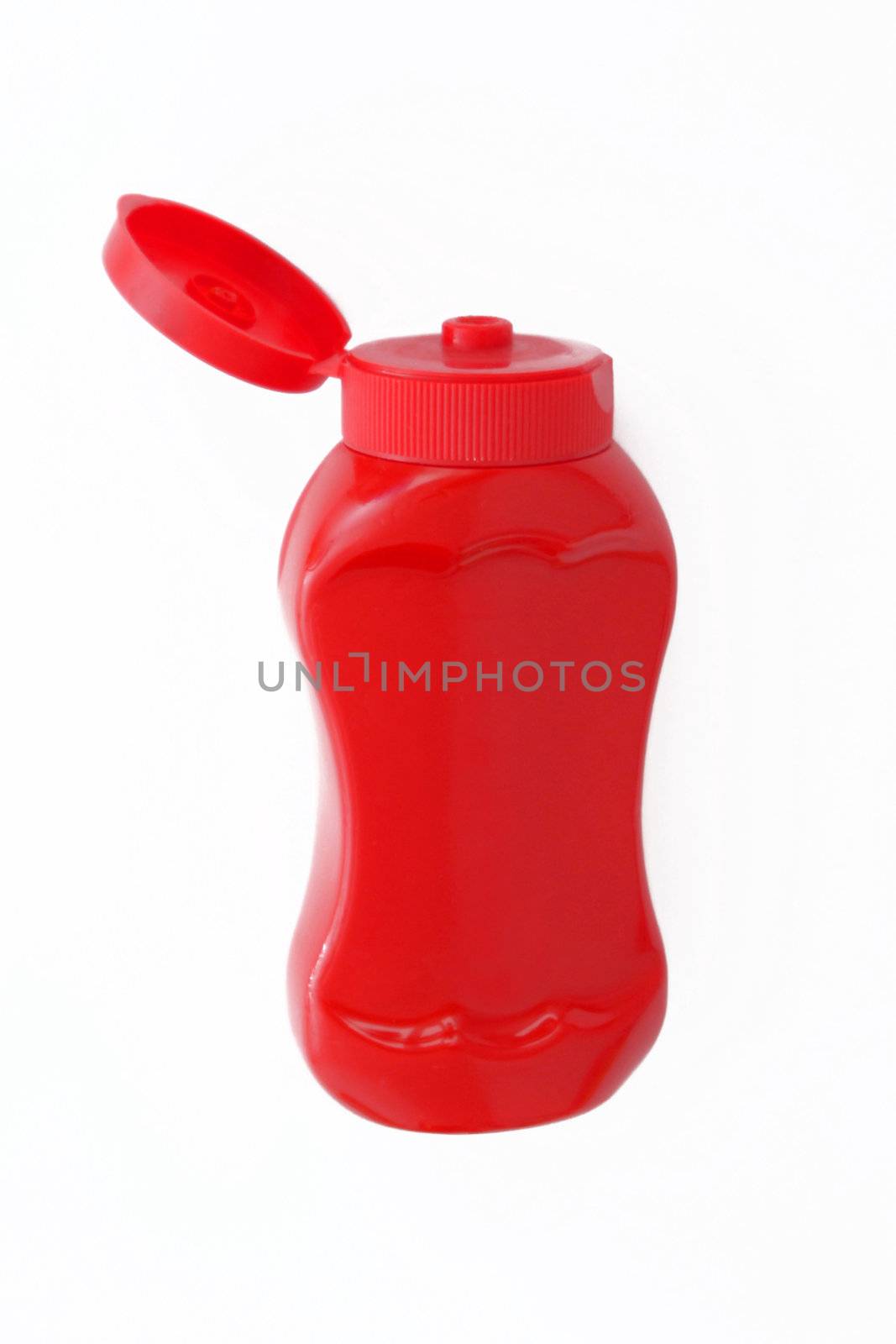 A red bottle of ketchup