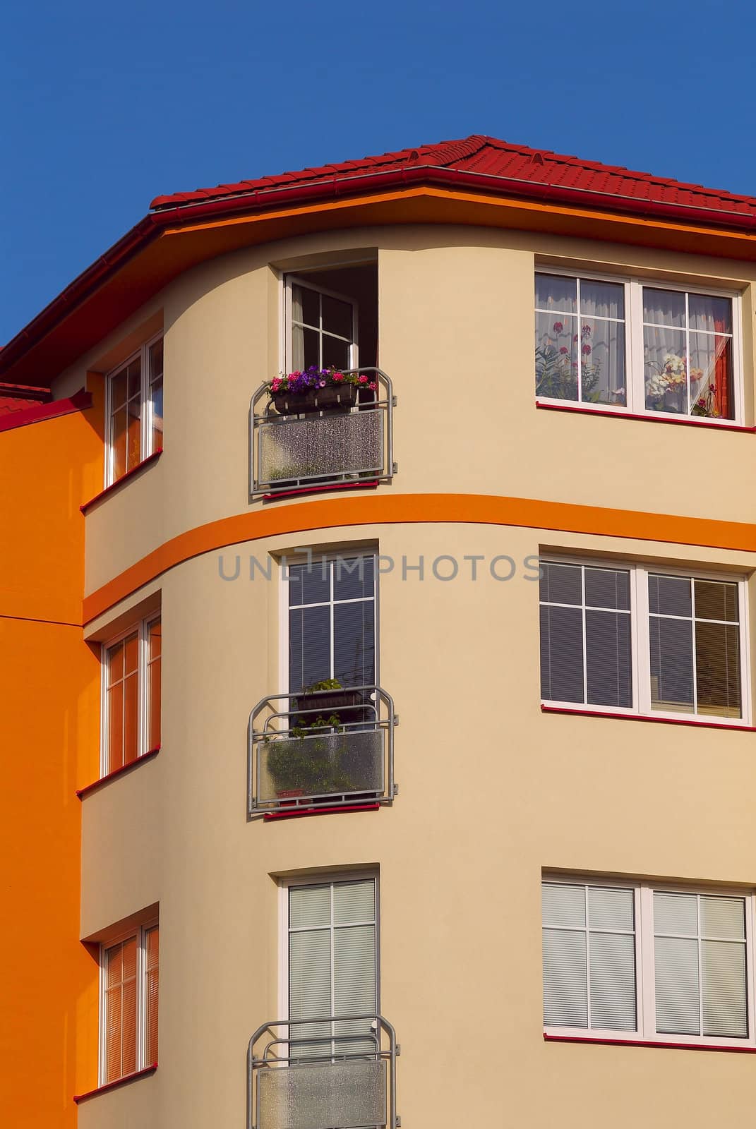 Photo of an apartment house in bright solar morning